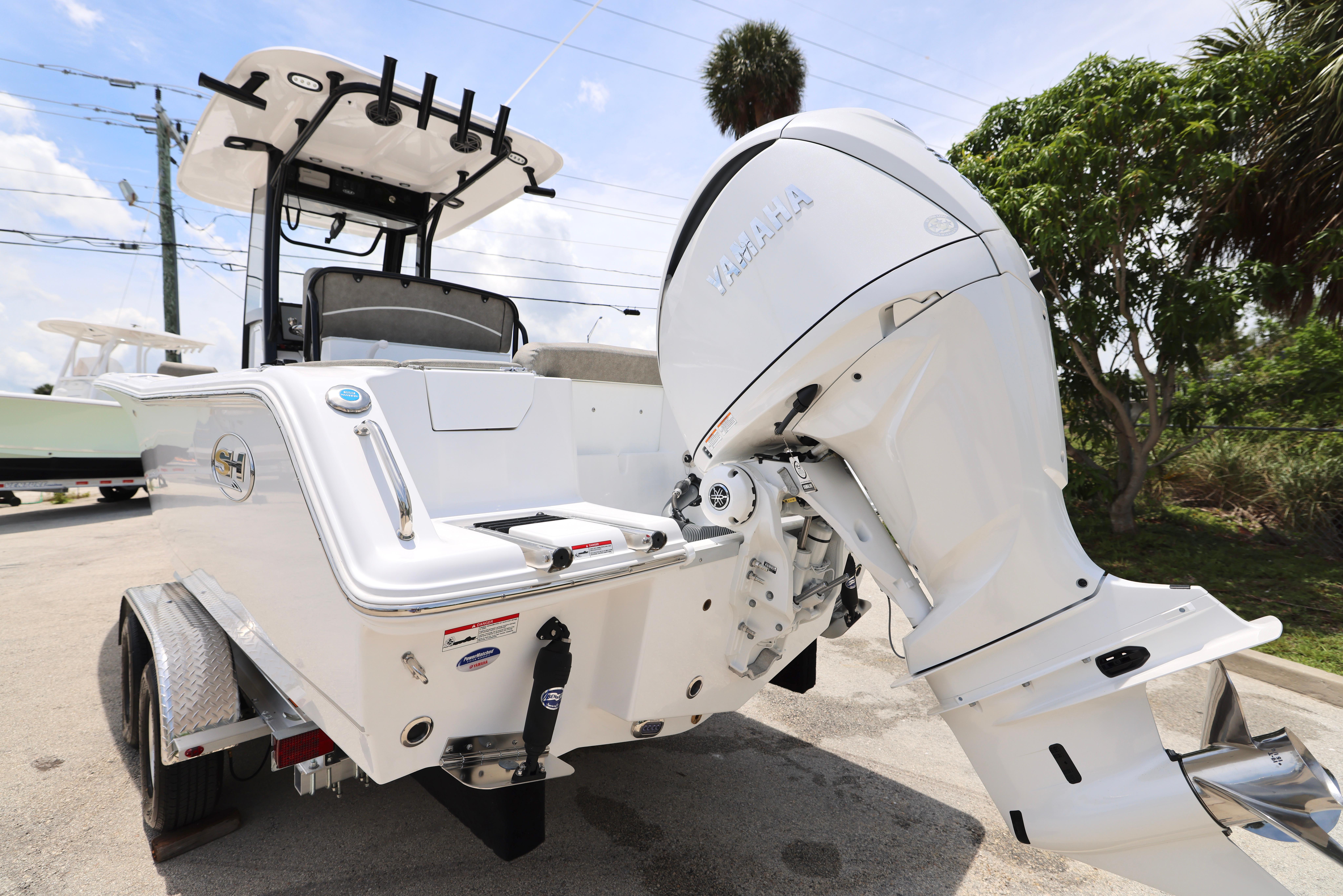 2026 Sea Hunt Ultra 245 SE boat with Yamaha outboard motor on trailer.