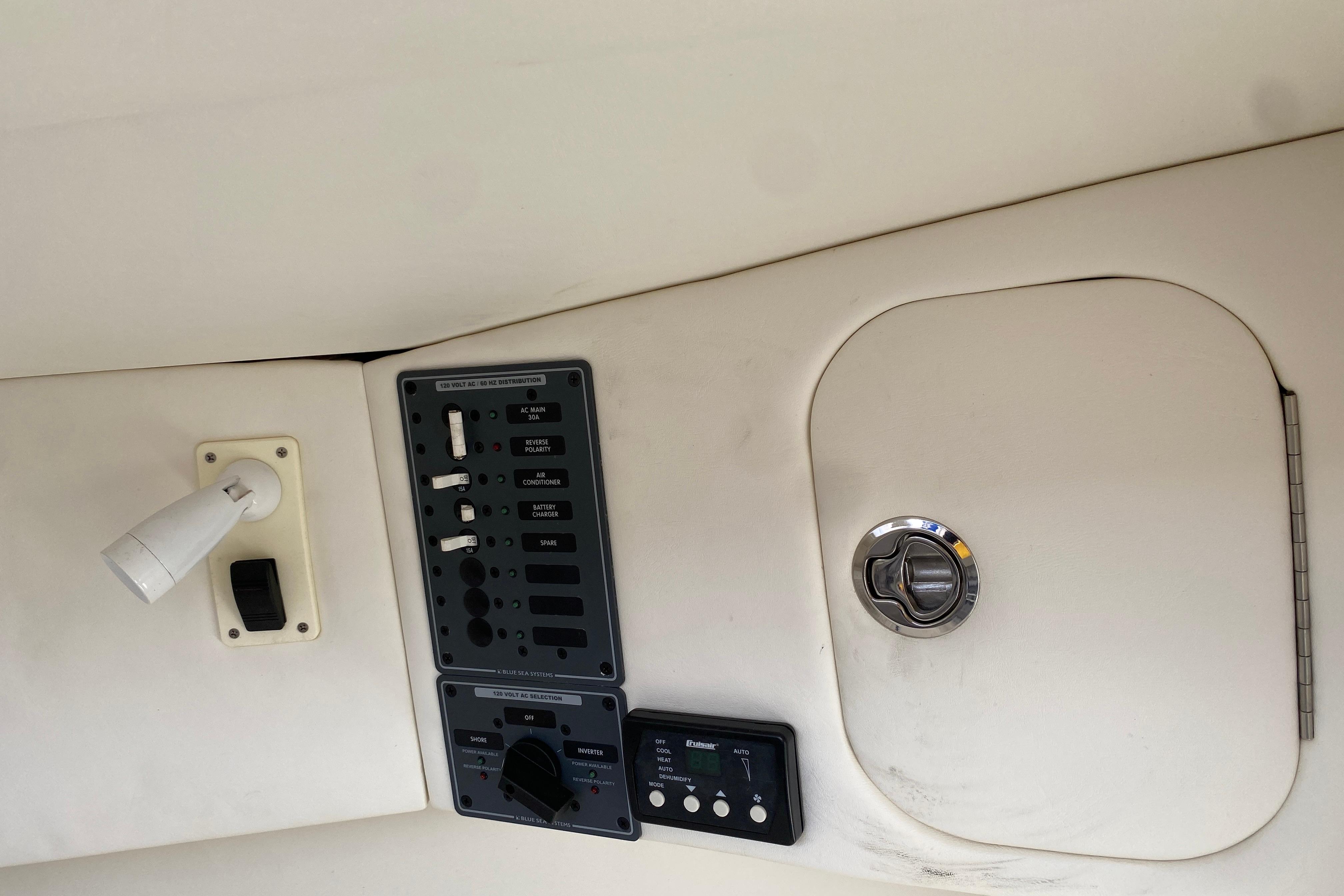 Control panel and storage compartment on a 2017 Midnight Express 39S Cuddy boat.