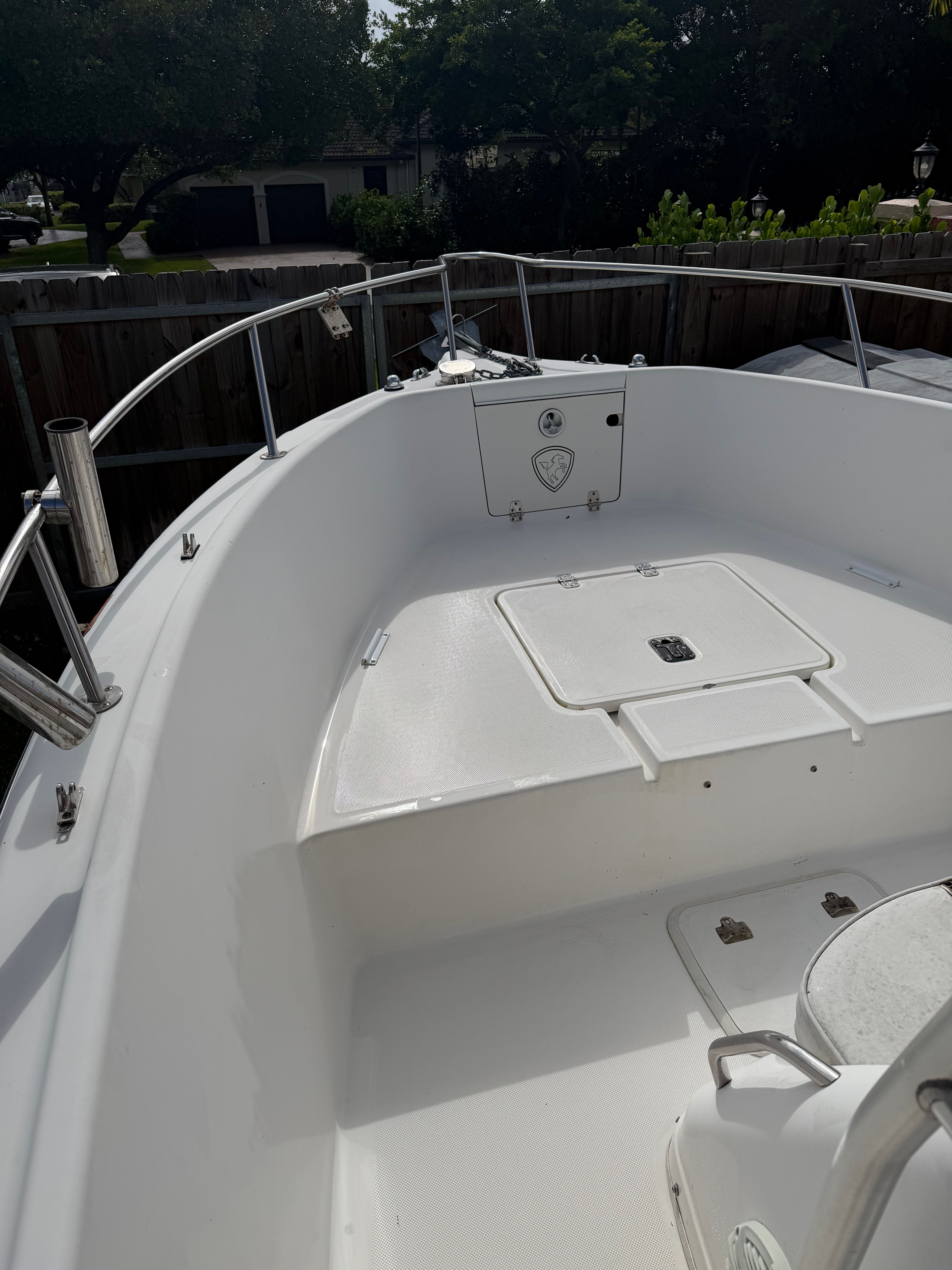 The image shows the bow of a 2001 Century 2100 Center Console boat with seating area.