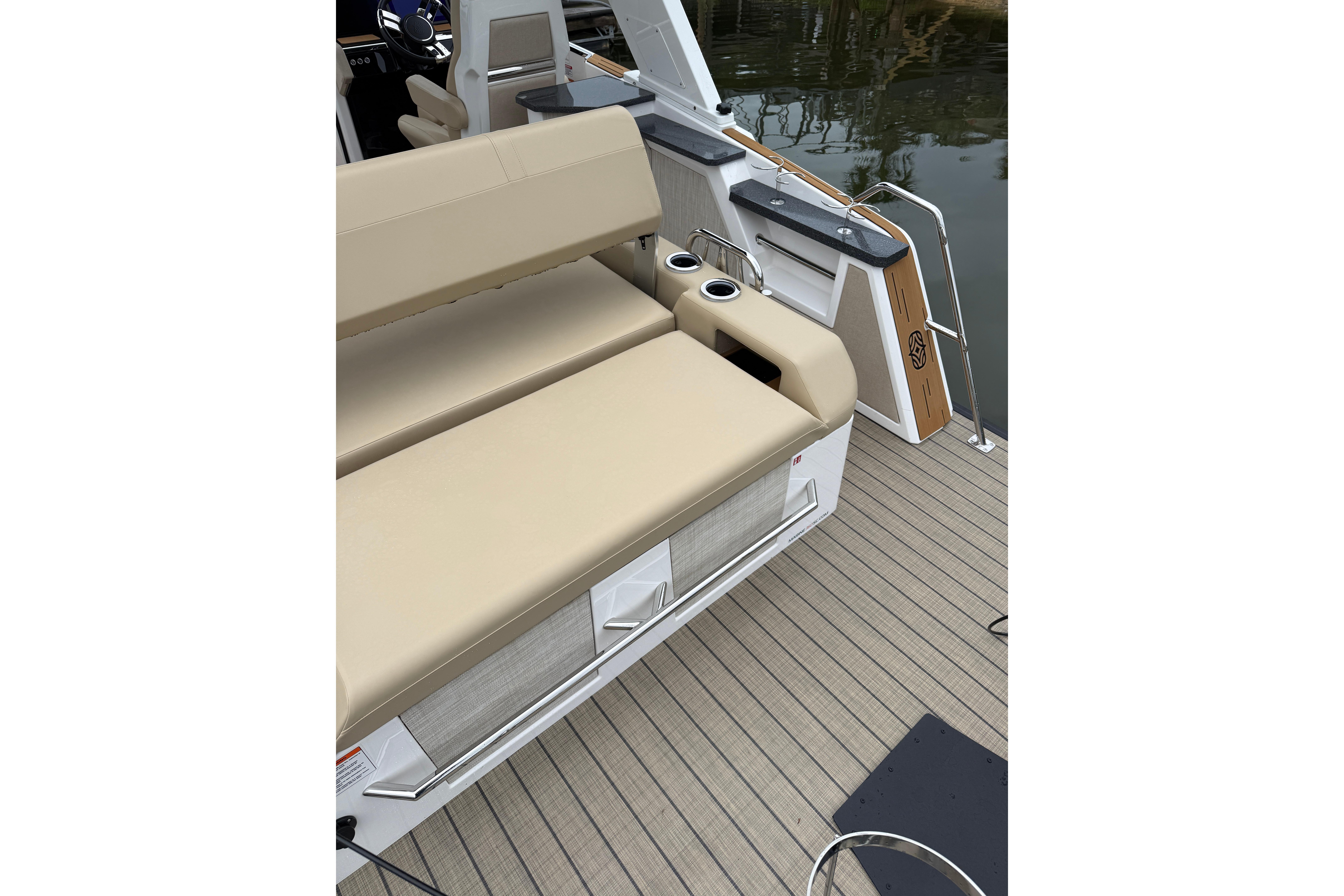 Luxury seating on the 2025 Balise Helix 26 L boat deck with cup holders.
