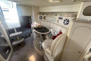 Interior of 2000 Rinker Fiesta Vee 310 boat with seating and table.