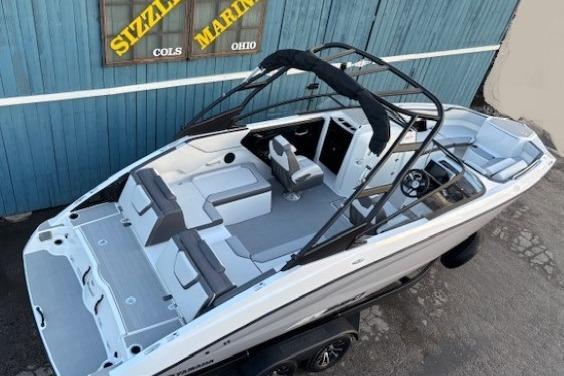 2026 Yamaha Boats AR250 with sleek design and spacious seating, displayed outdoors.