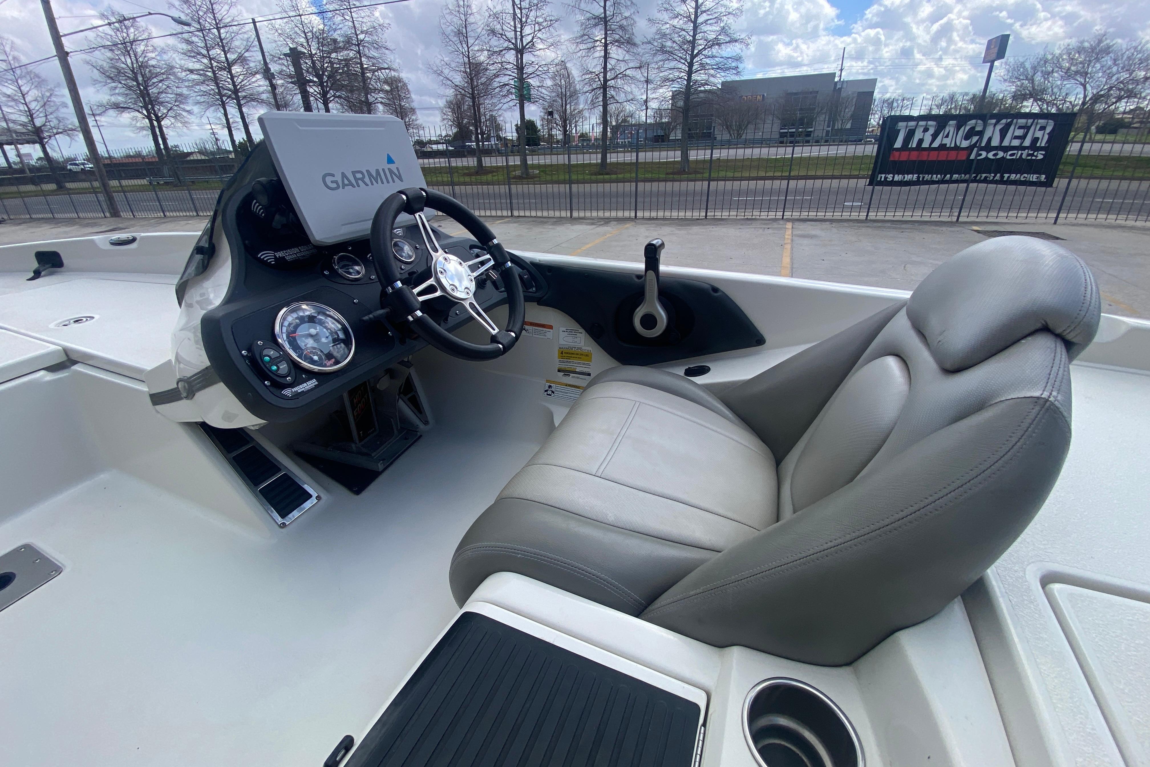 2018 Scarab 215 G boat interior with Garmin navigation and comfortable seating.