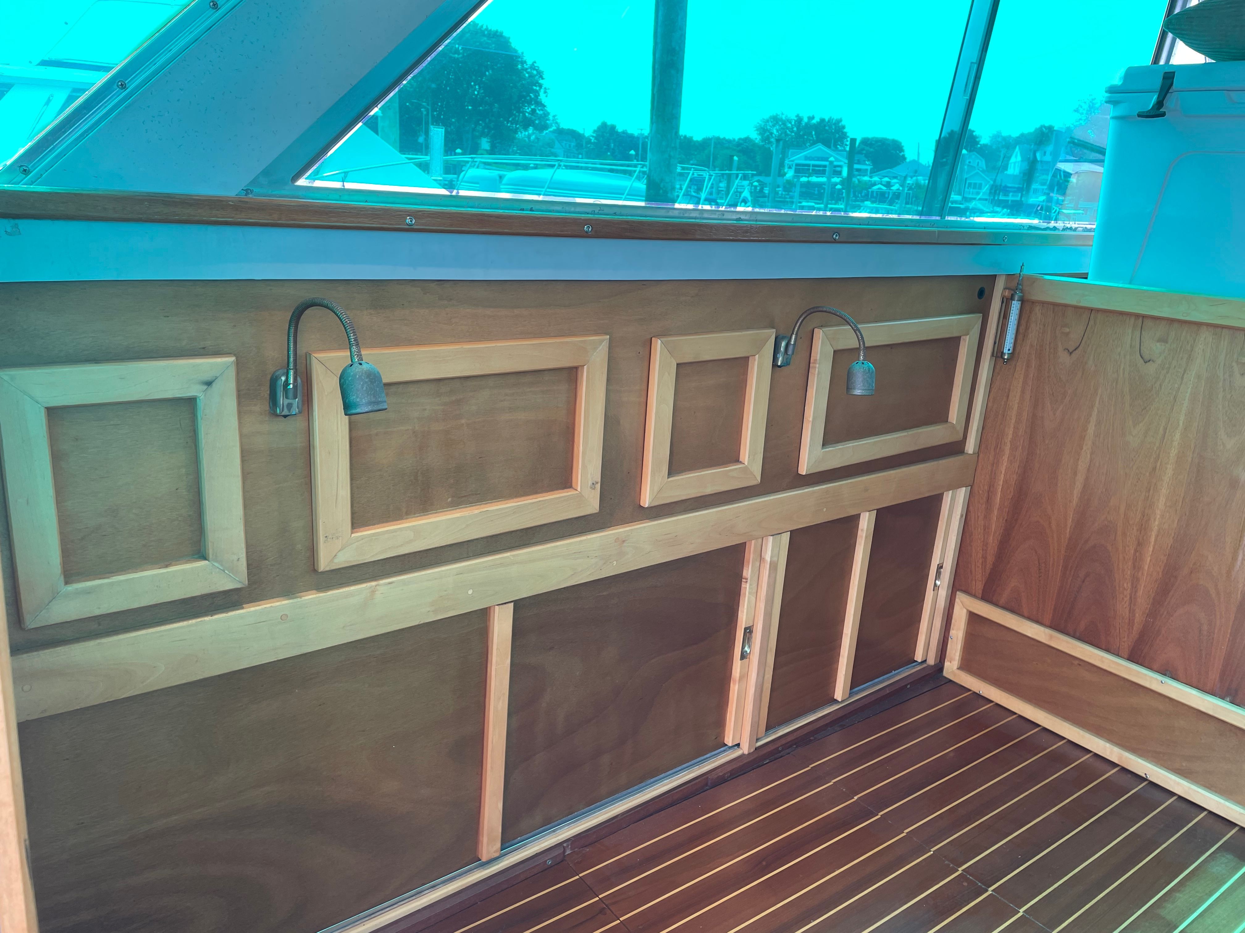 Interior of a 1969 Bertram Caribe with wooden paneling.