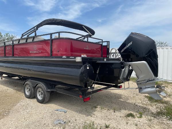 2023 Regency 250DL3 pontoon boat on trailer with Mercury outboard motor.
