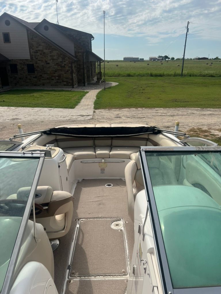 Interior view of a 2006 Chaparral 246 SSi boat with beige seating.