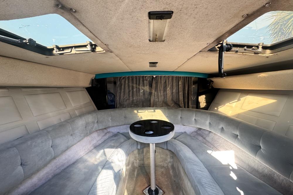Interior of a 1989 Formula 292 SR-1 boat with plush seating and skylights.