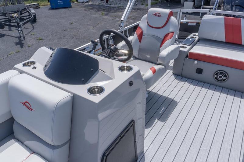 2026 SunCatcher Select 322SL boat interior with steering wheel and seating.