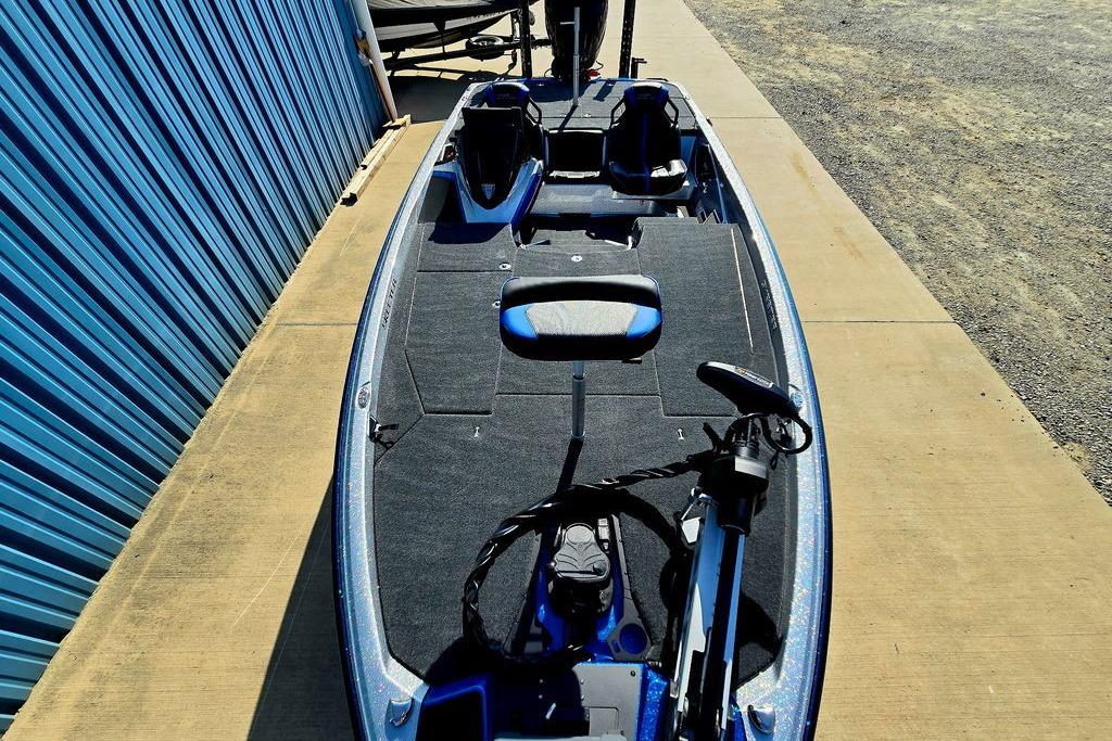 2026 Skeeter ZXE20 fishing boat with modern seating and equipment, parked on concrete.