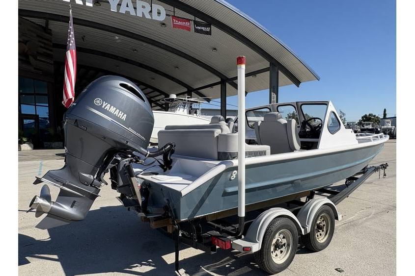 1997 Scully's 18 WT boat with Yamaha motor on trailer at marina.