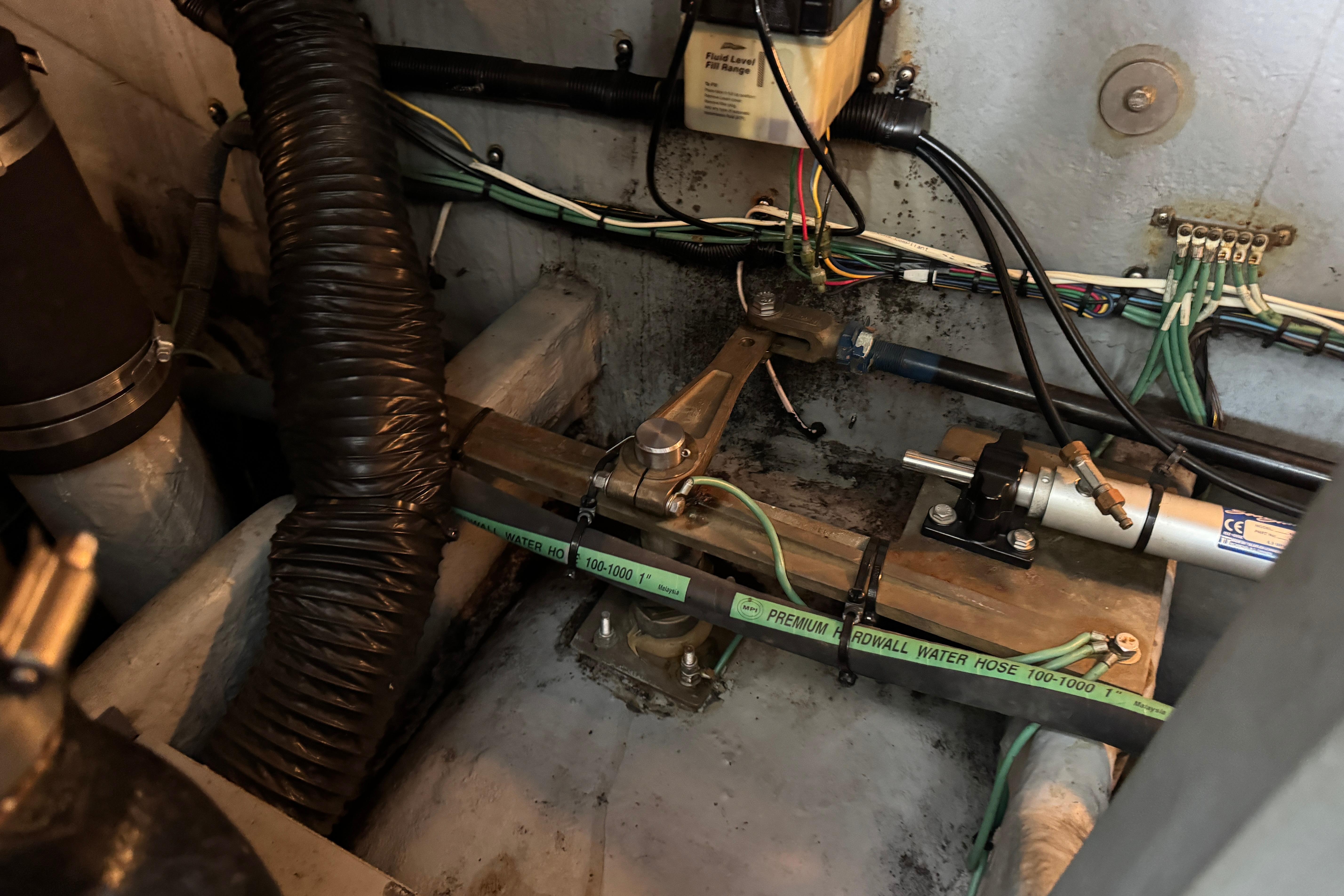 Engine compartment of a 2001 Sea Ray 380 Sundancer with hoses and wiring.