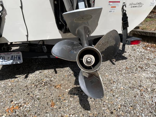 Propeller of 2021 Tracker Pro 195 XTE boat on gravel surface.