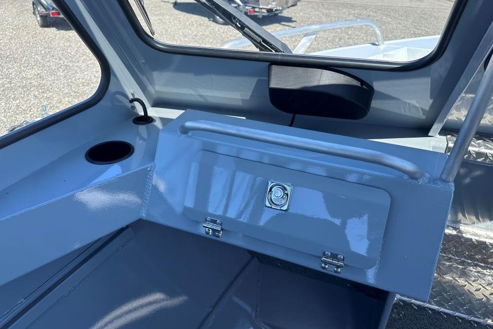 Interior view of 2026 Hewescraft 200 ProV ET boat, featuring storage compartment and cup holder.
