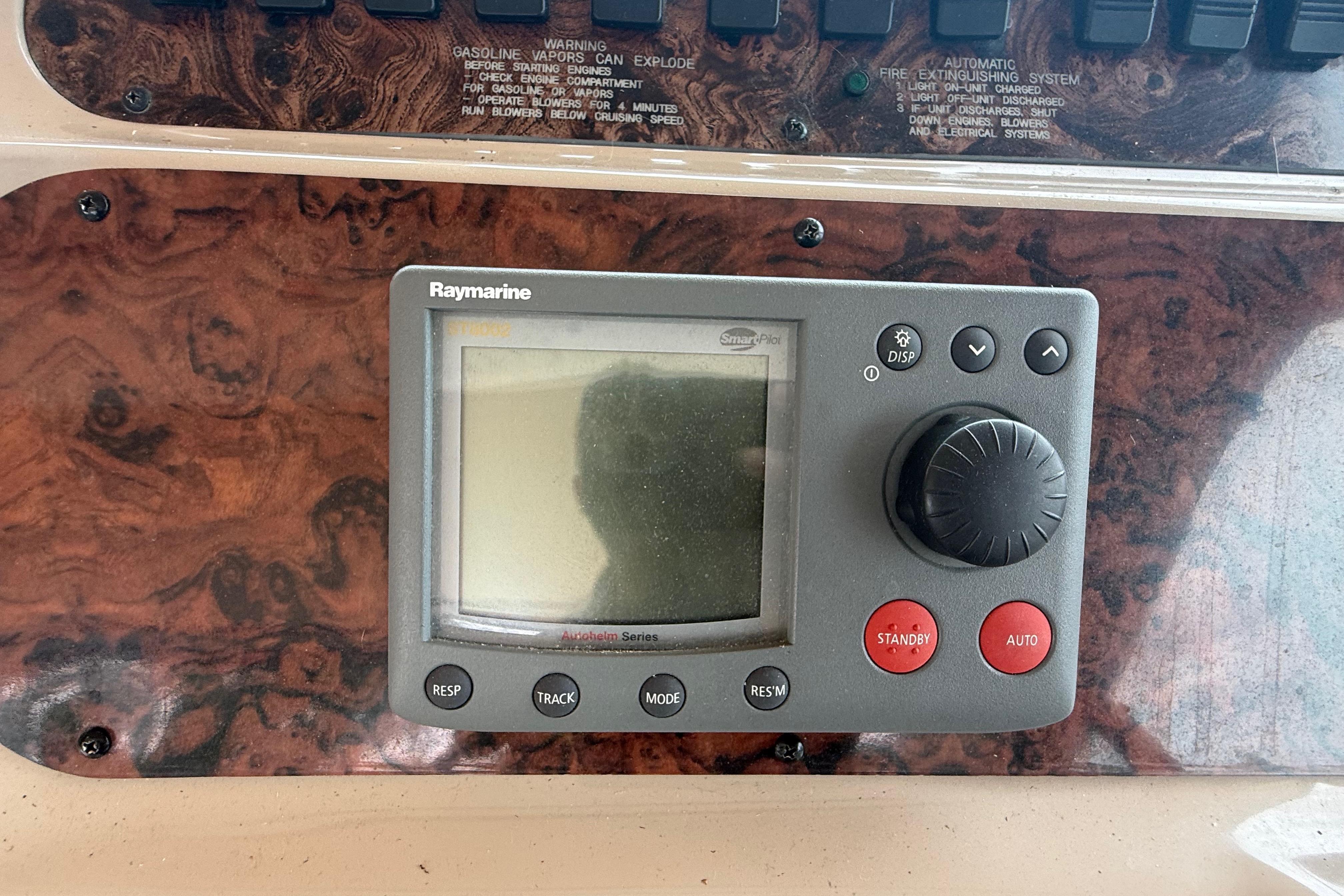 Raymarine autopilot control on 1998 Sea Ray Sundancer 400 dashboard.