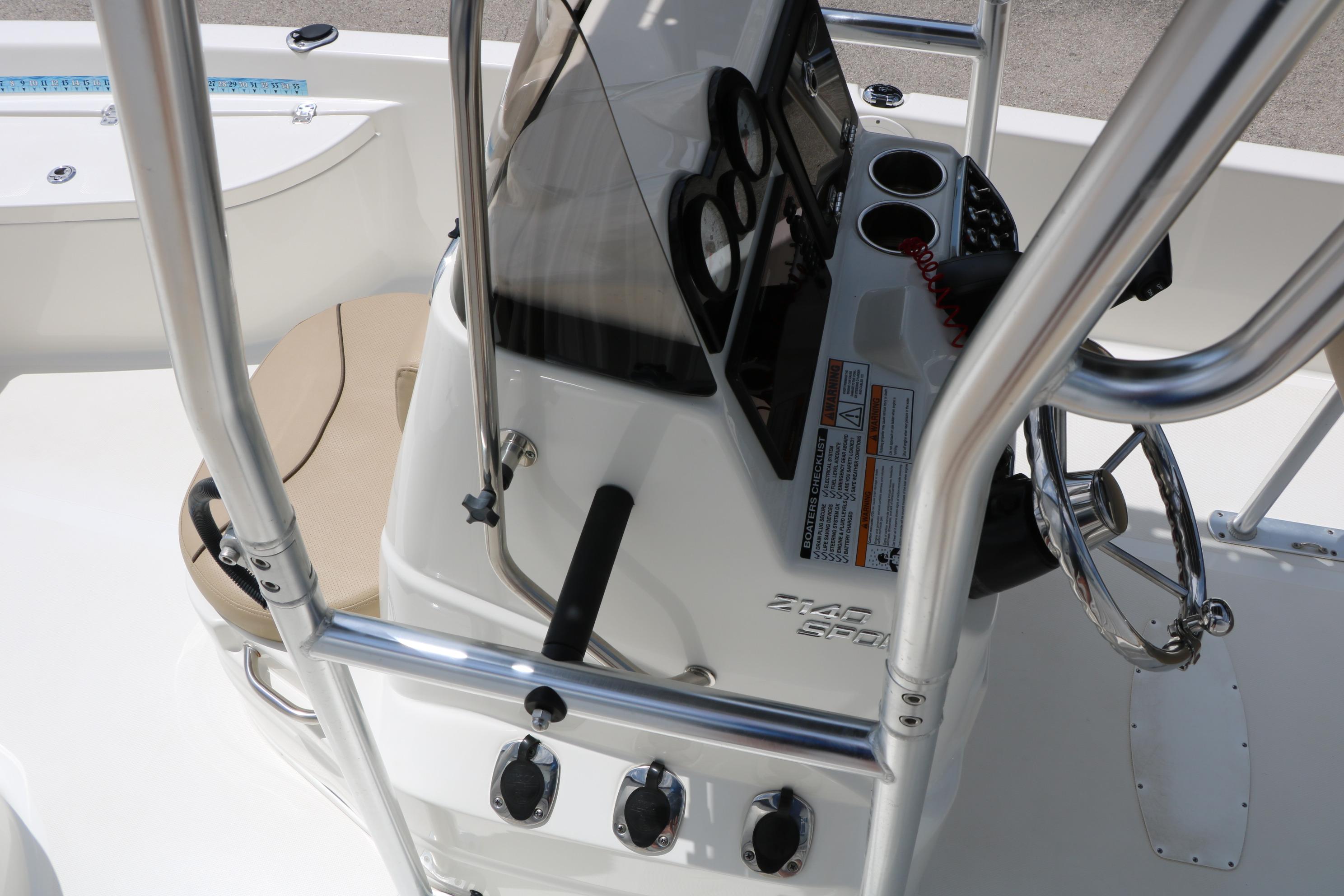 2020 NauticStar 2140 Sport boat console with steering wheel and controls.