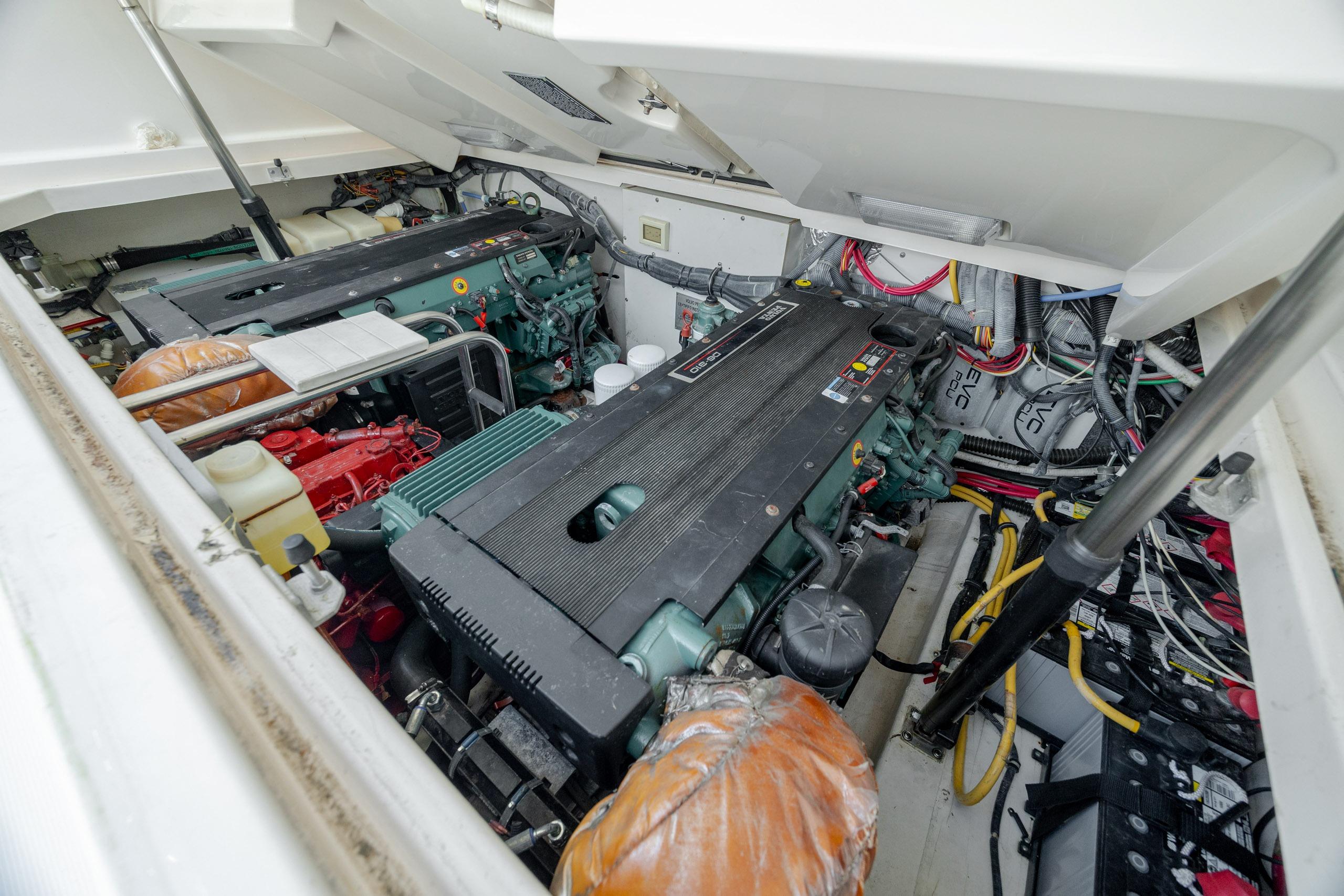 Engine compartment of a 2004 Tiara Yachts 3200 Open, showcasing dual engines and wiring.