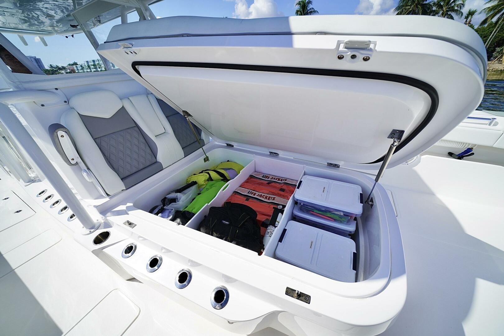 2024 Invincible 35 Catamaran storage compartment with life jackets and gear, open on deck.
