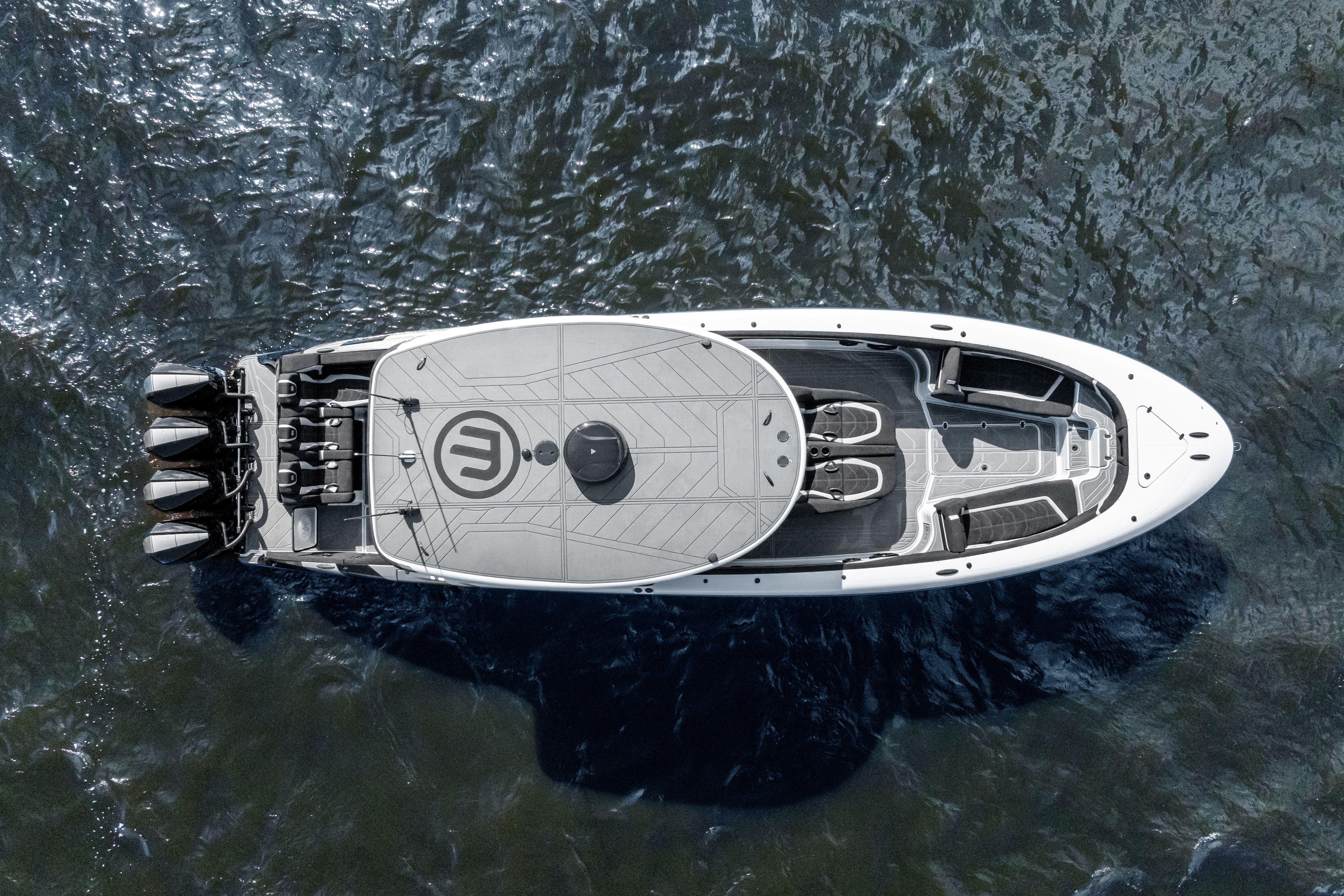 Aerial view of 2027 Mystic Powerboats M4200 on water, showcasing sleek design and powerful engines.