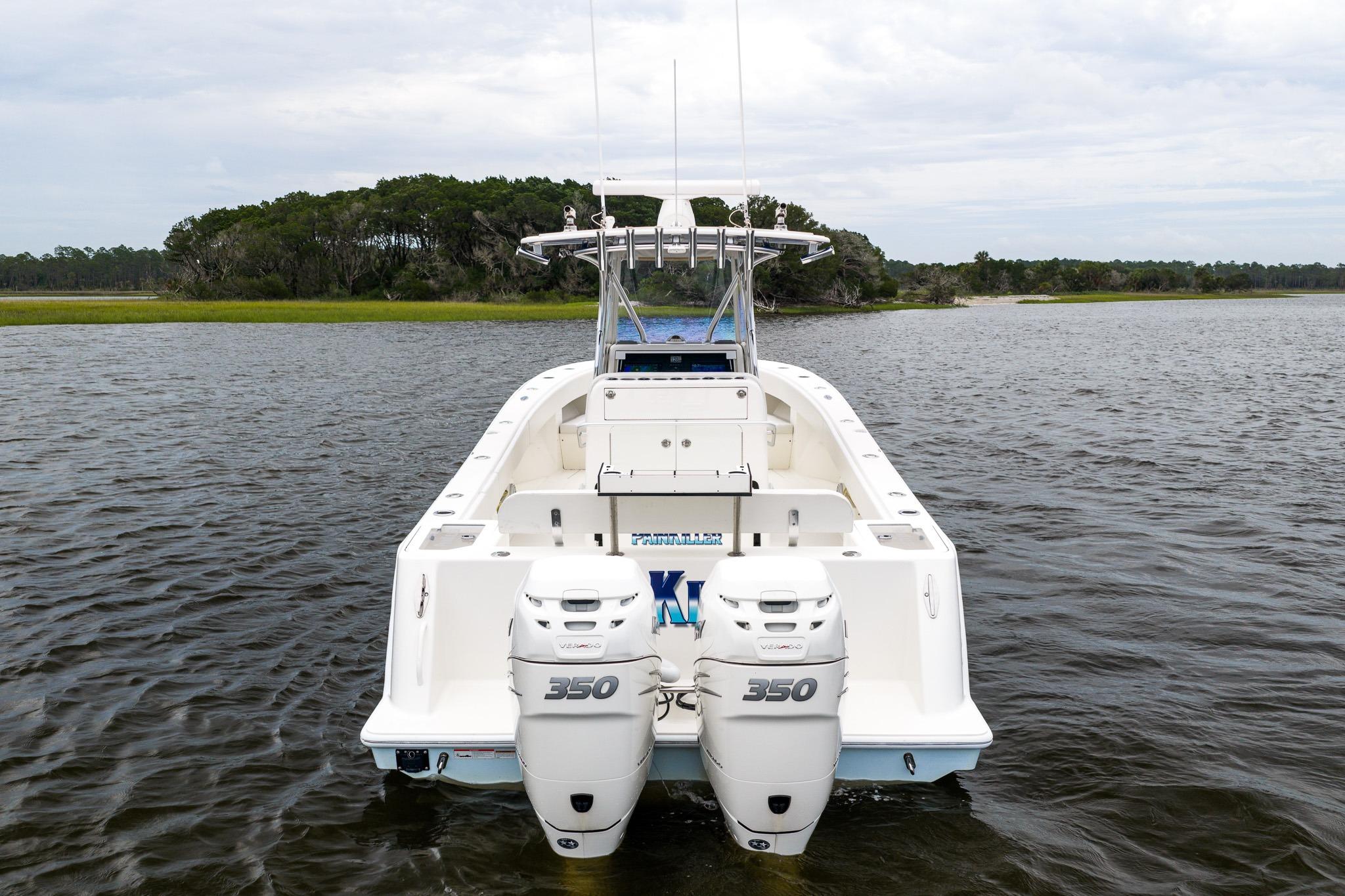 2019 SeaVee 322Z boat with twin 350 engines on a calm lake.