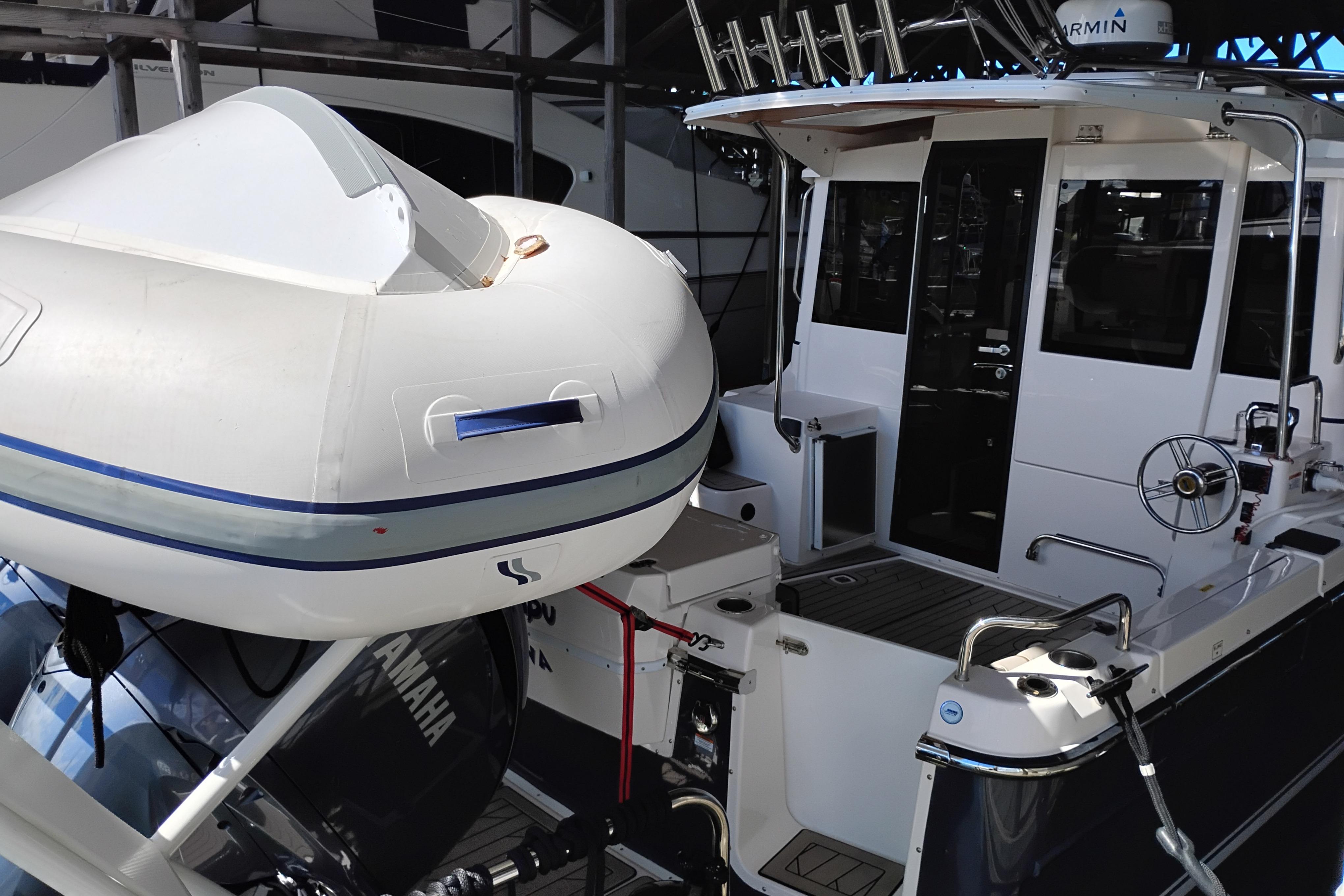 2022 Cutwater C-32 Coupe with Yamaha engine and inflatable boat on deck.