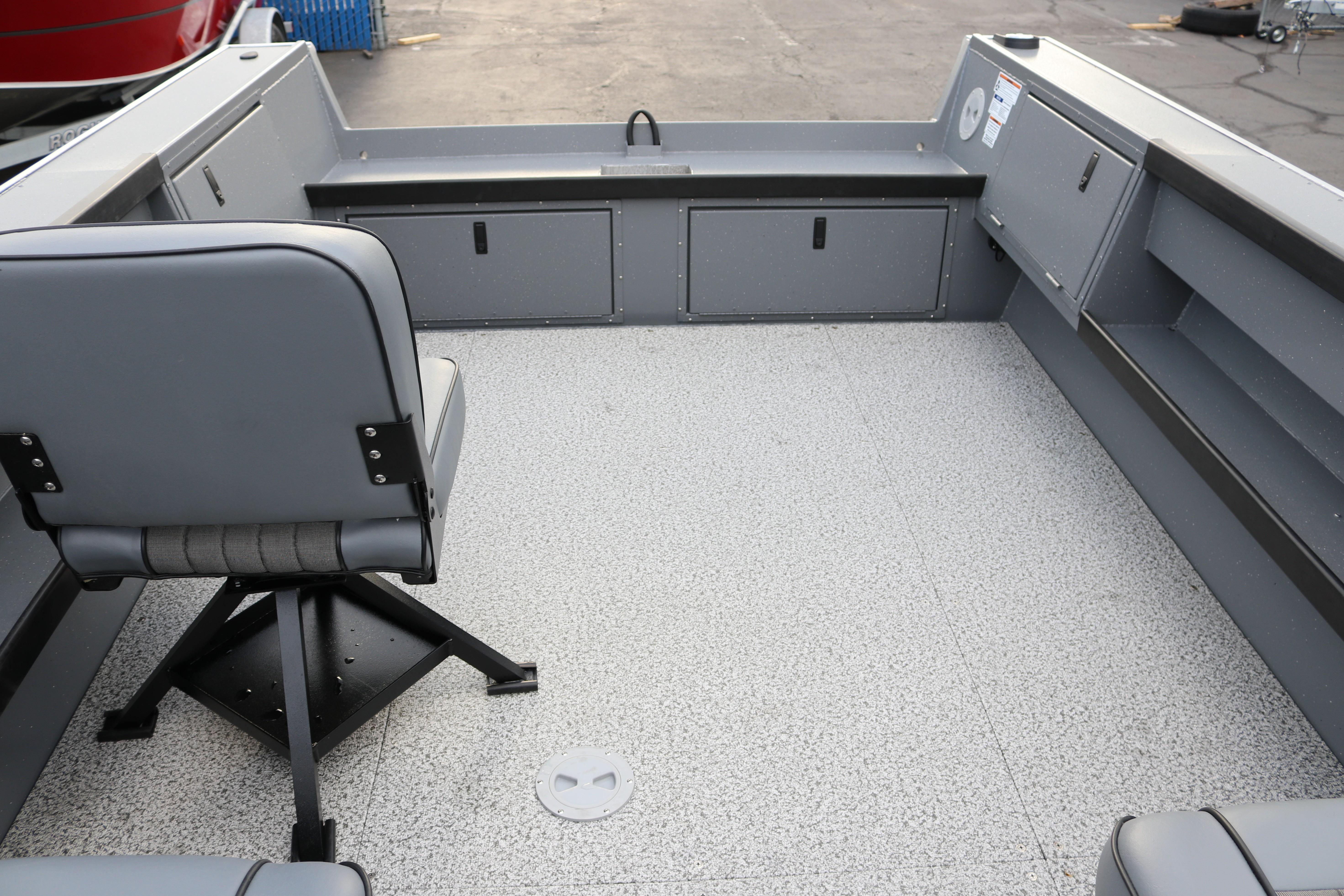 2026 Alumaweld Columbia 23 boat interior with gray seating and storage compartments.
