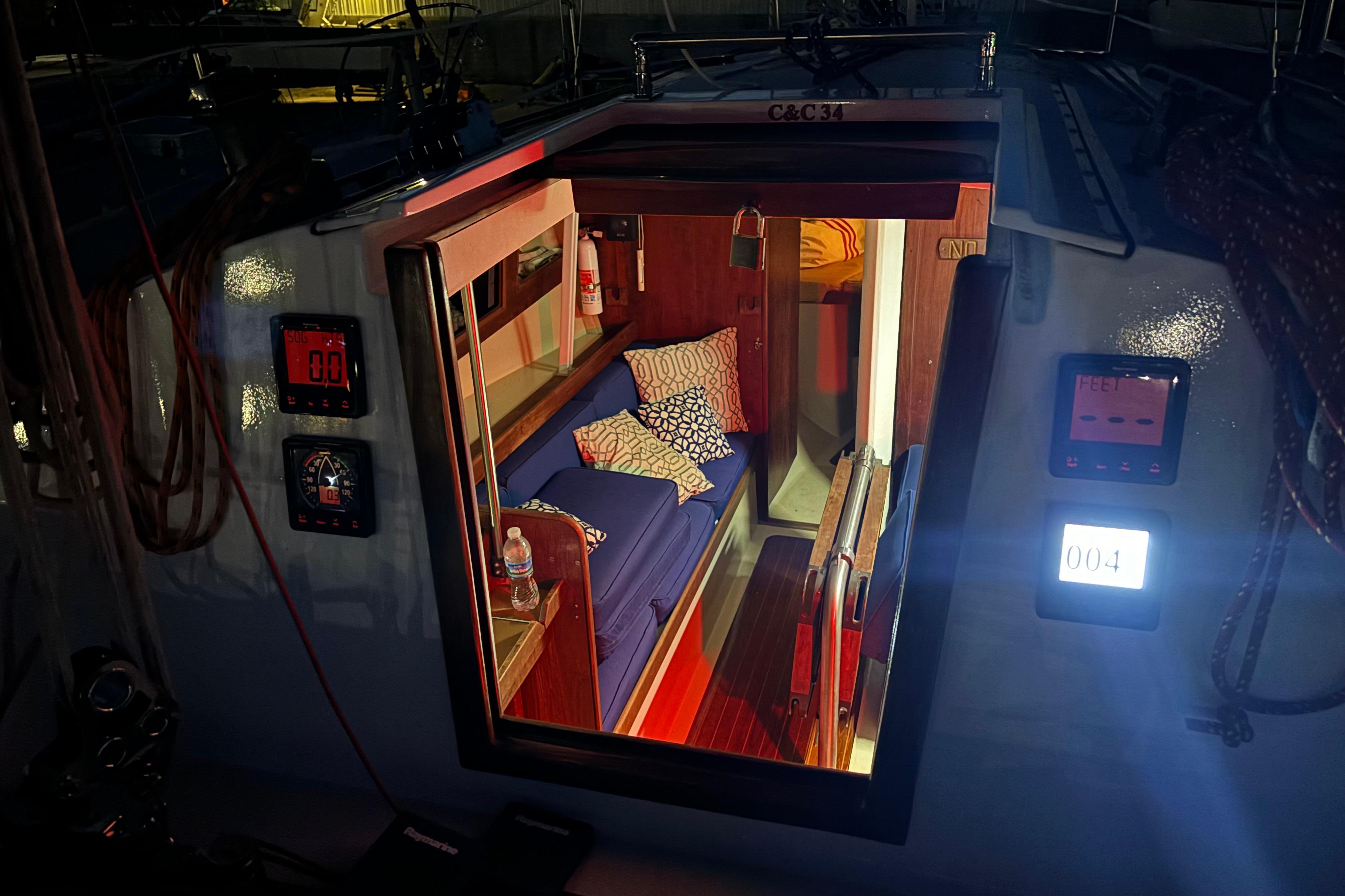 Interior view of a 1993 Catalina 34 MkII sailboat cabin at night.