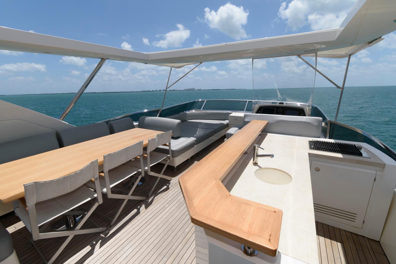 Luxurious 2013 Azimut 84 Flybridge Motor Yacht with spacious outdoor seating and dining area.