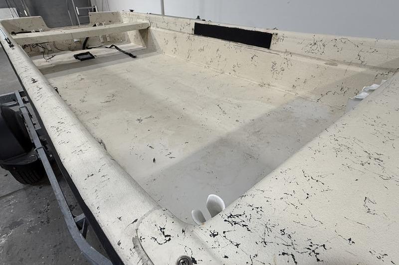 1998 Carolina Skiff 1965 V boat interior with textured surface and minimal equipment.