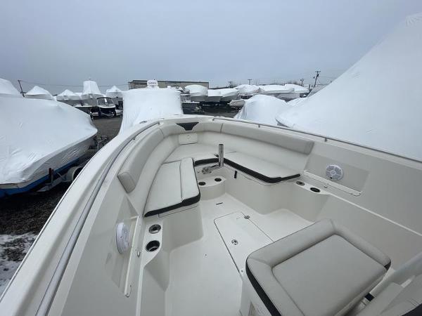 2023 Sailfish 290 CC boat interior with seating, in a covered storage area.