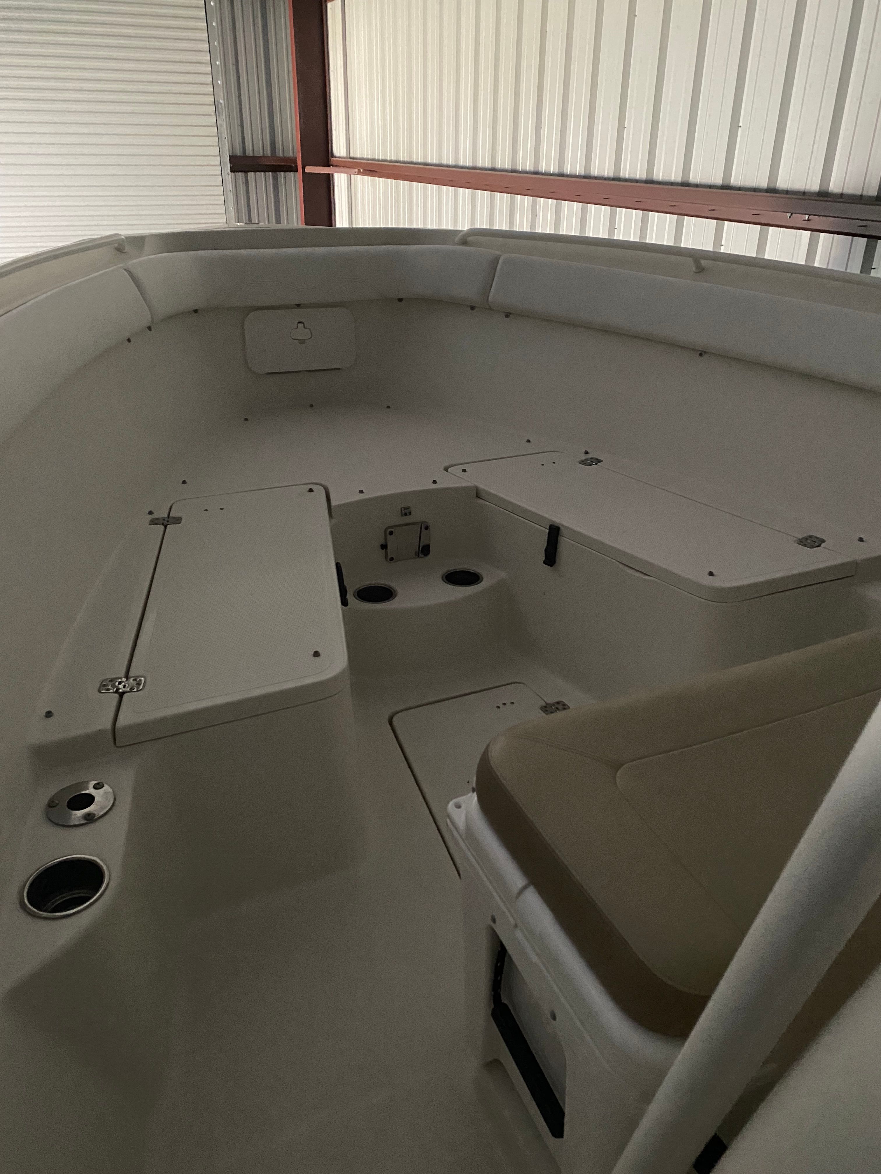 The interior of a Sailfish 270 CC boat with seating and storage compartments.