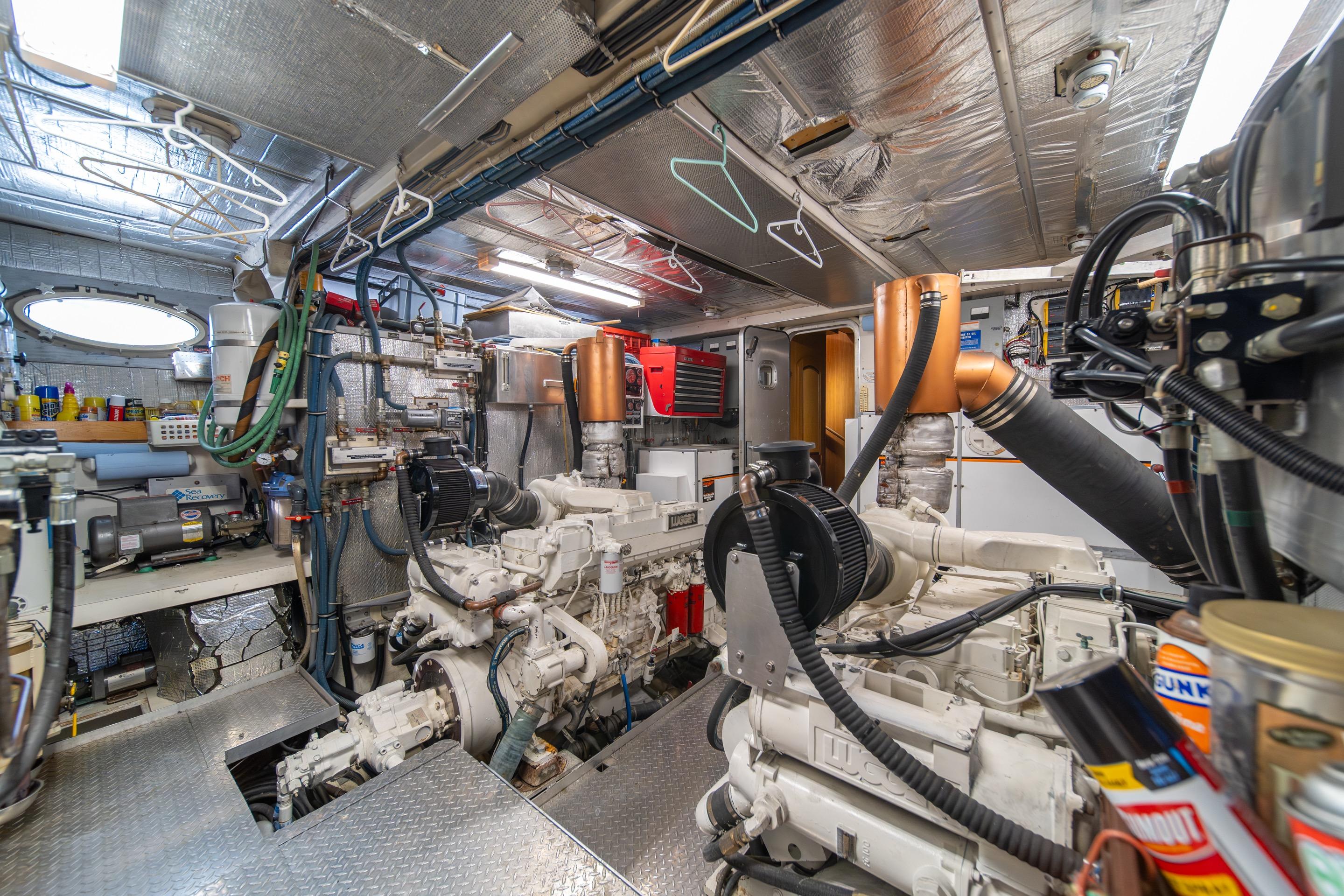Engine room of a 1991 Forbes Cooper Pilothouse Motoryacht, showcasing machinery and equipment.