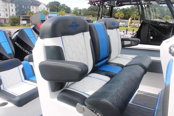 2024 Fountain 34 SC boat seats with blue and white upholstery, showcasing luxury design.