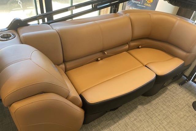 Luxurious tan seating in 2026 Regency 230 DL boat interior.