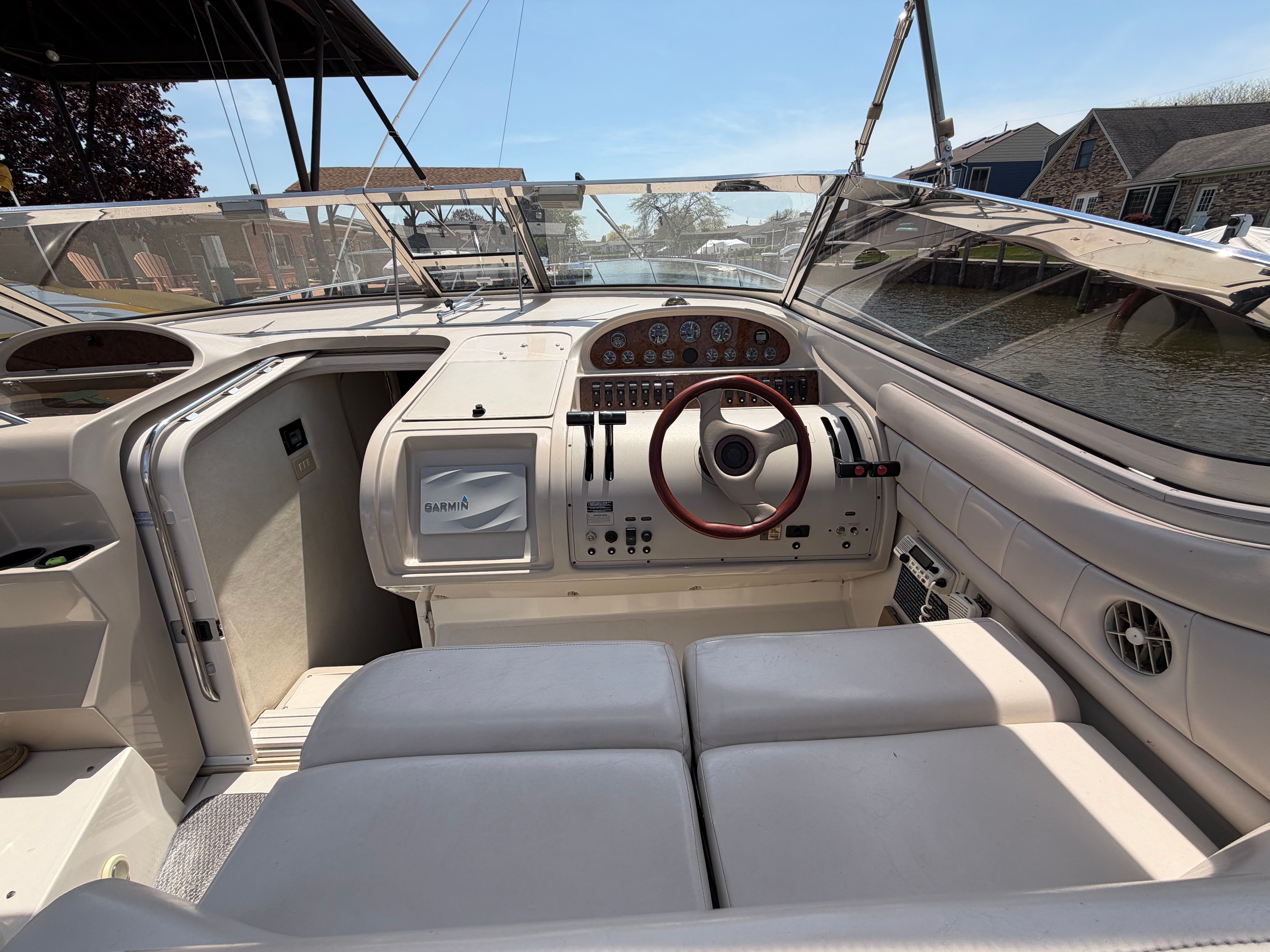 Interior of a 1997 Regal Commodore boat with steering console.