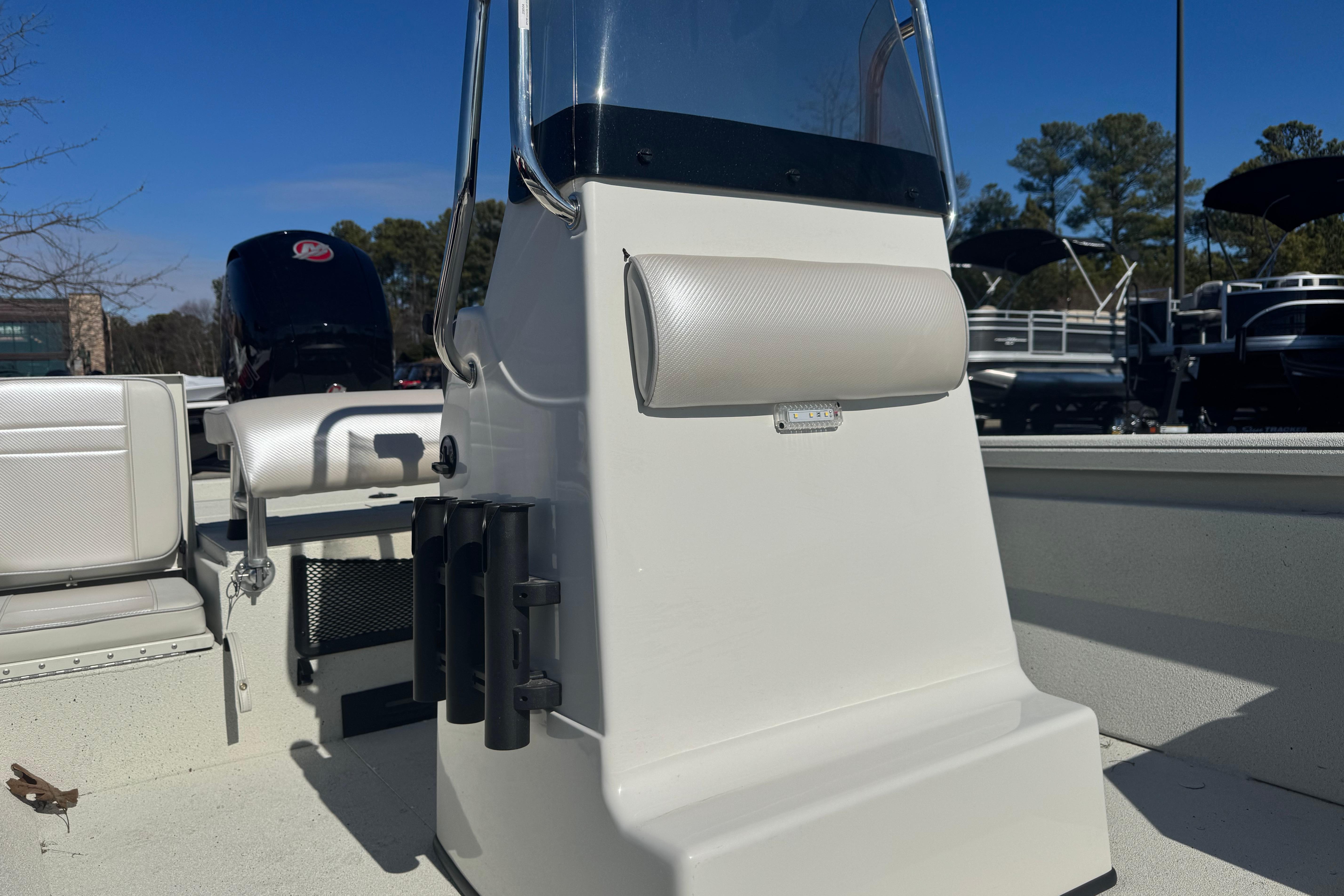 2026 Ranger RB200 boat console with rod holders and seating, under clear blue sky.