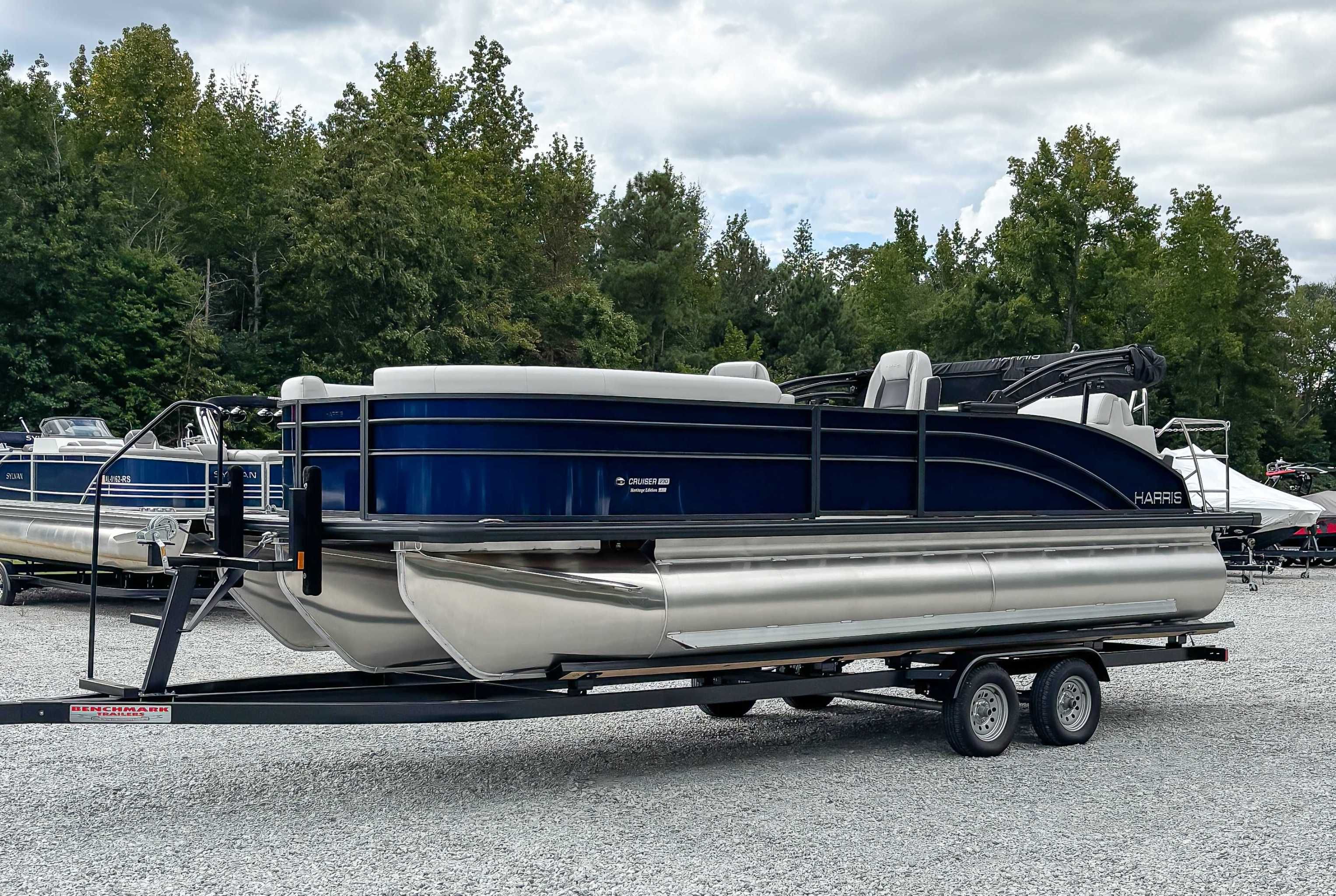 2026 Harris Cruiser 230 SLDH pontoon boat on trailer.