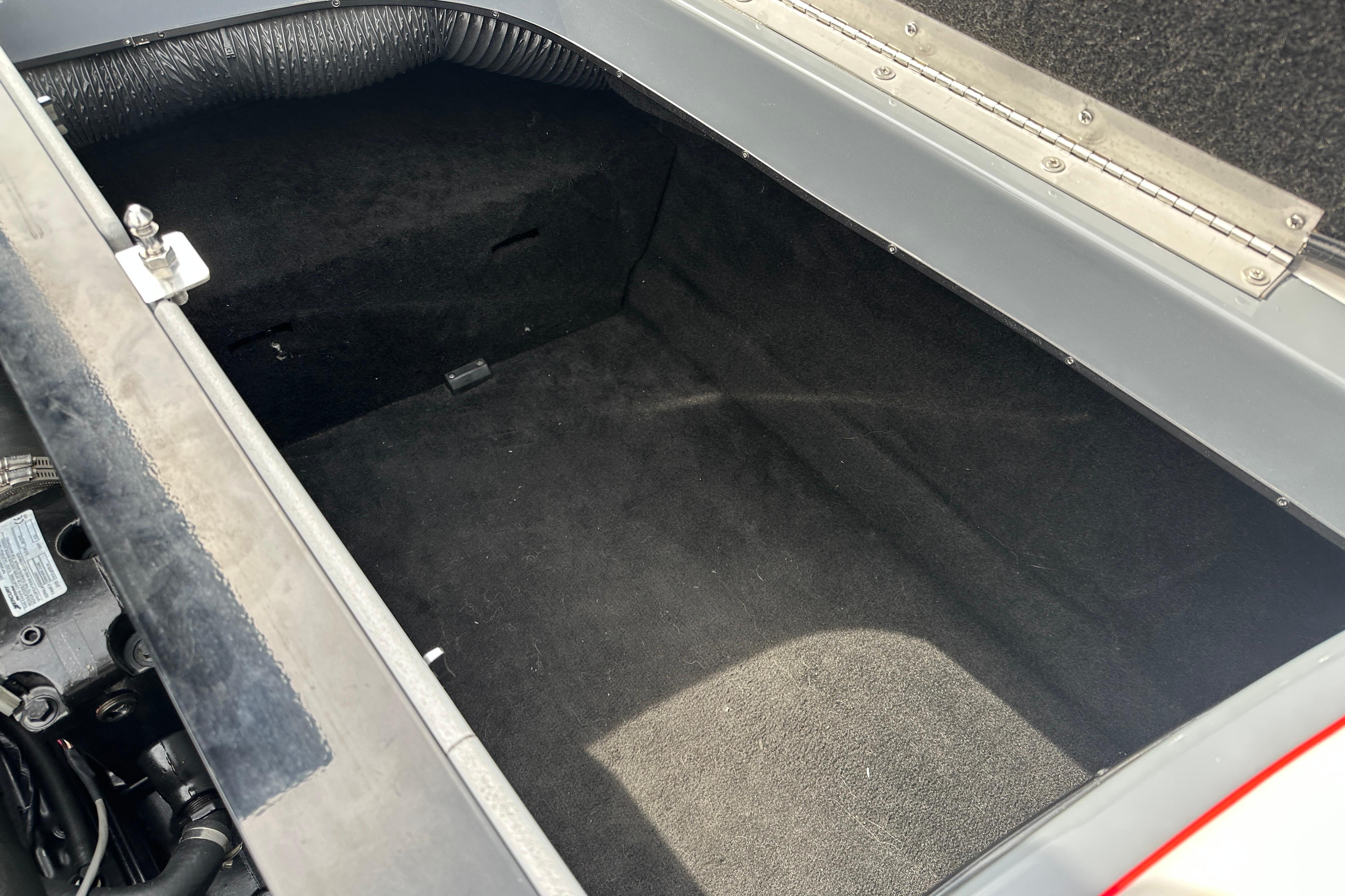 Open storage compartment in a 2008 Centurion Enzo SV240 boat.