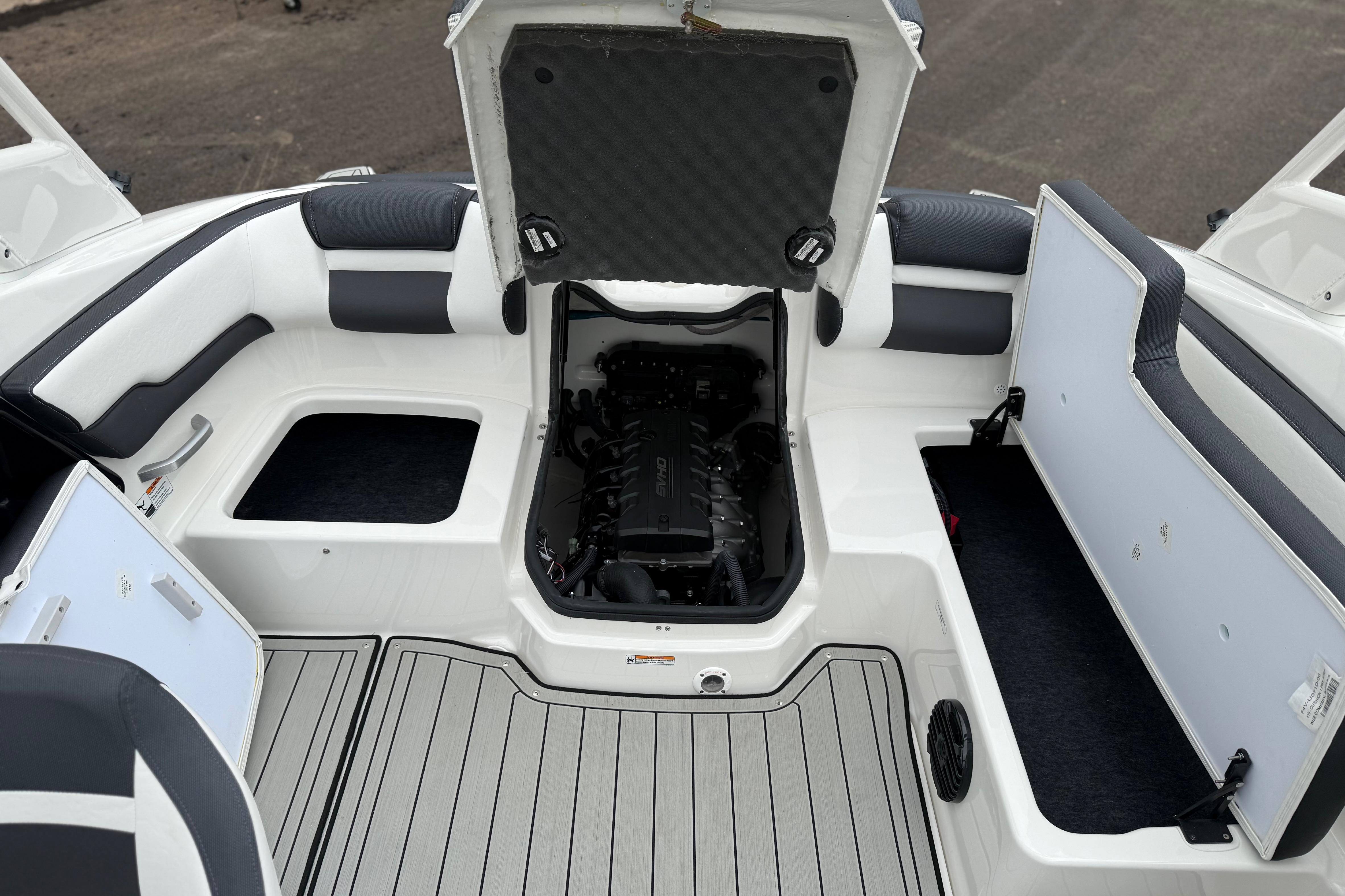 2025 Yamaha Boats 195S interior showing engine compartment and seating area.