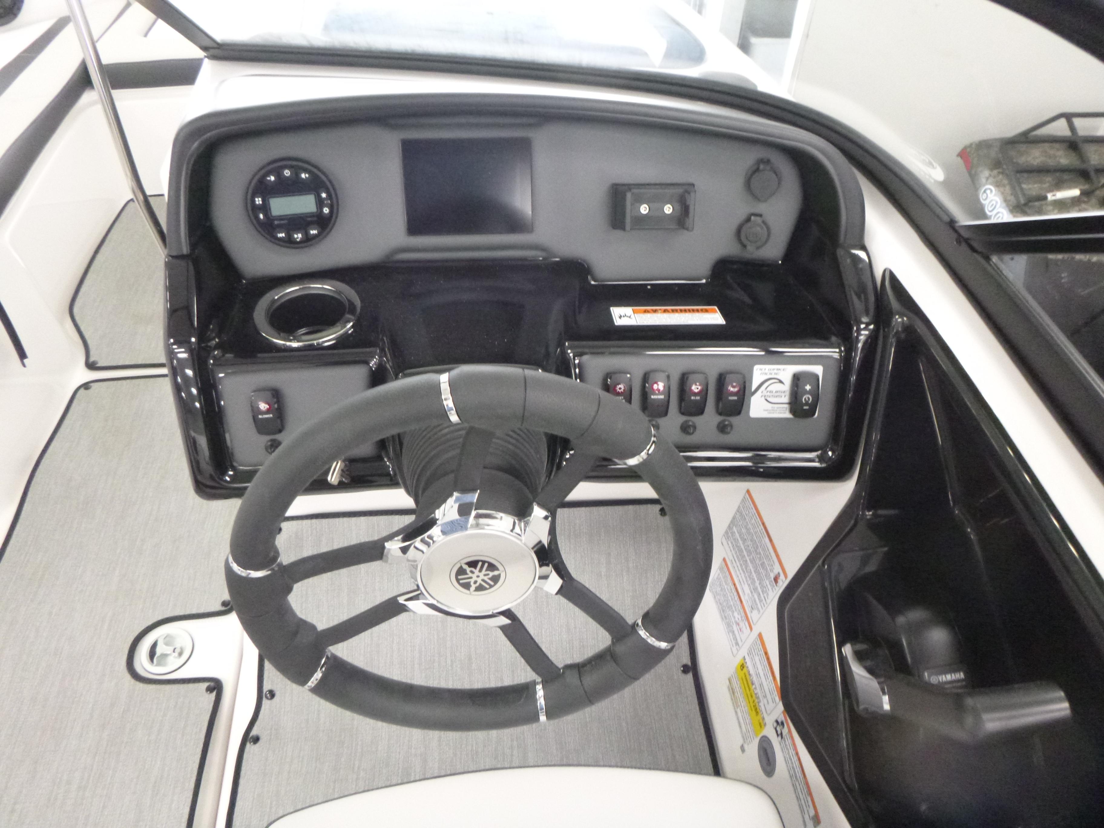 2025 Yamaha AR195 boat dashboard with steering wheel and control panel.