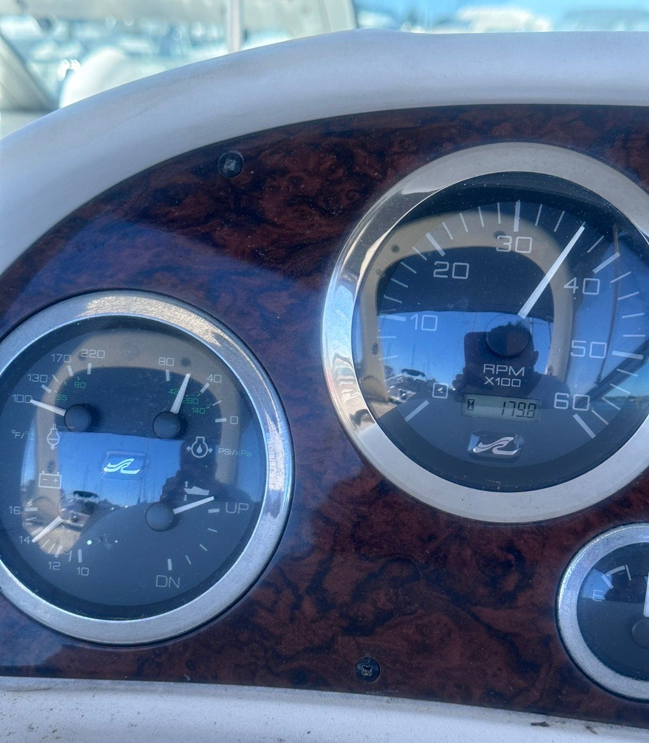 Close-up of a 2002 Sea Ray 300 Sundancer dashboard with speedometers.