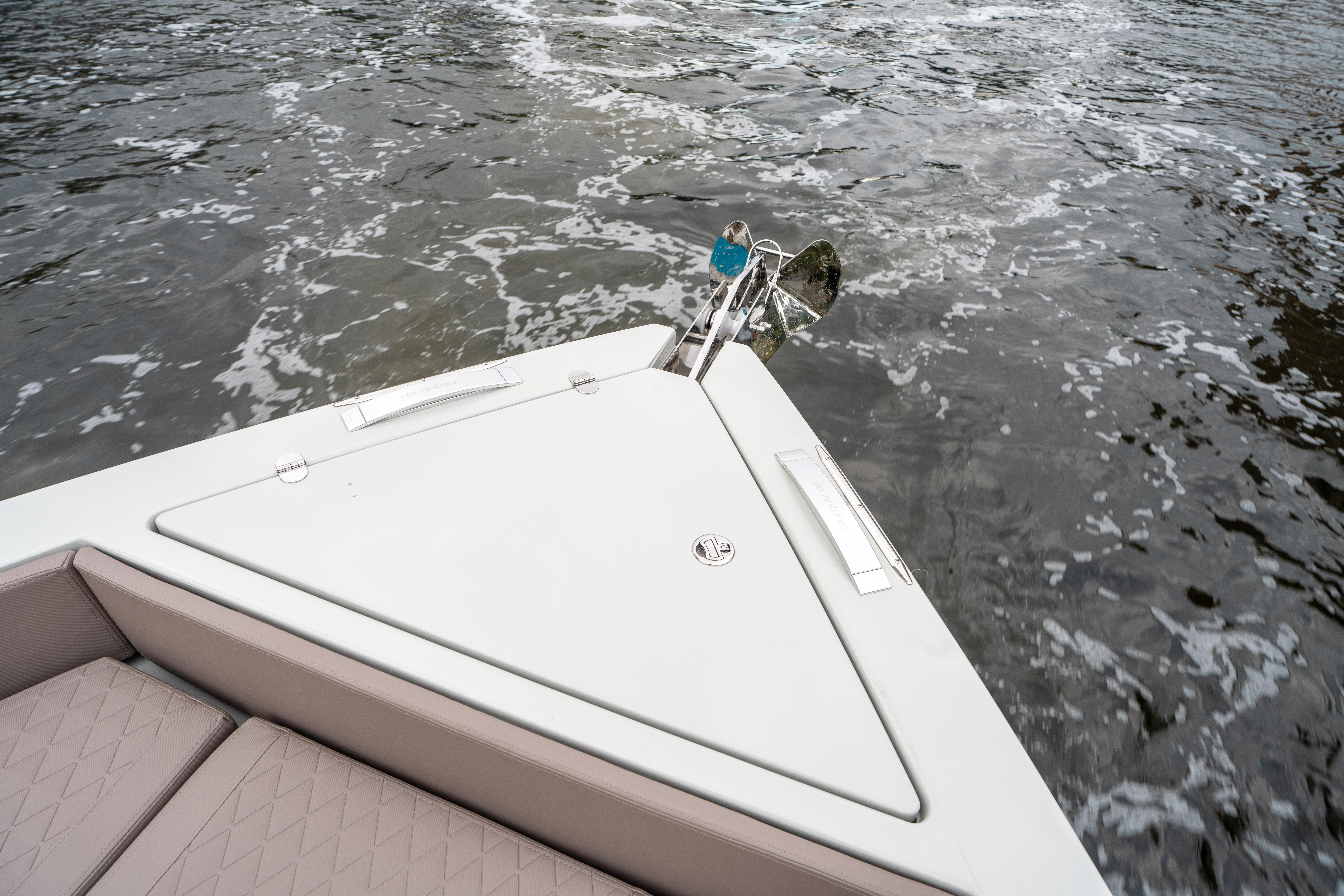 Bow of 2025 De Antonio Yachts D42 Open on water, featuring sleek design and anchor.