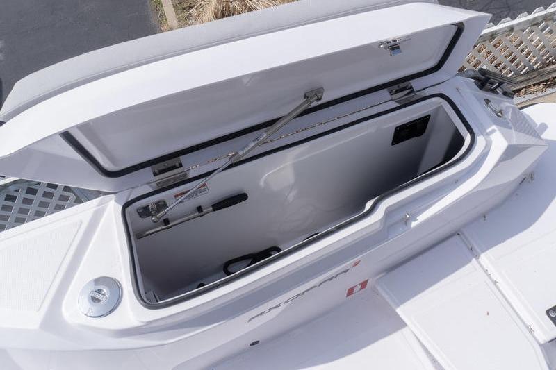 Open storage compartment on 2025 Axopar 29 XC Cross Cabin boat.