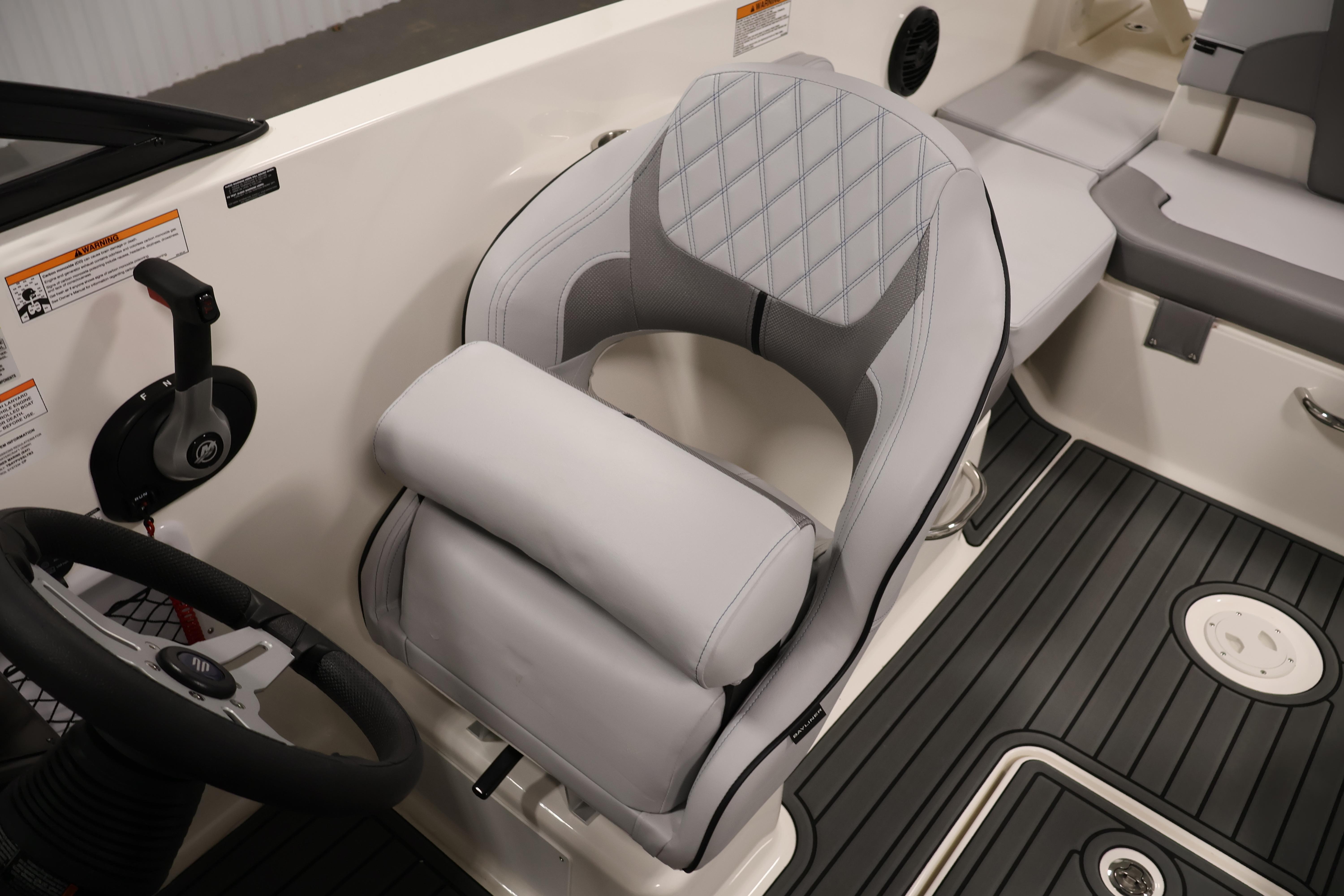 2026 Bayliner VR6 Bowrider I/O interior with modern helm and cushioned seating.