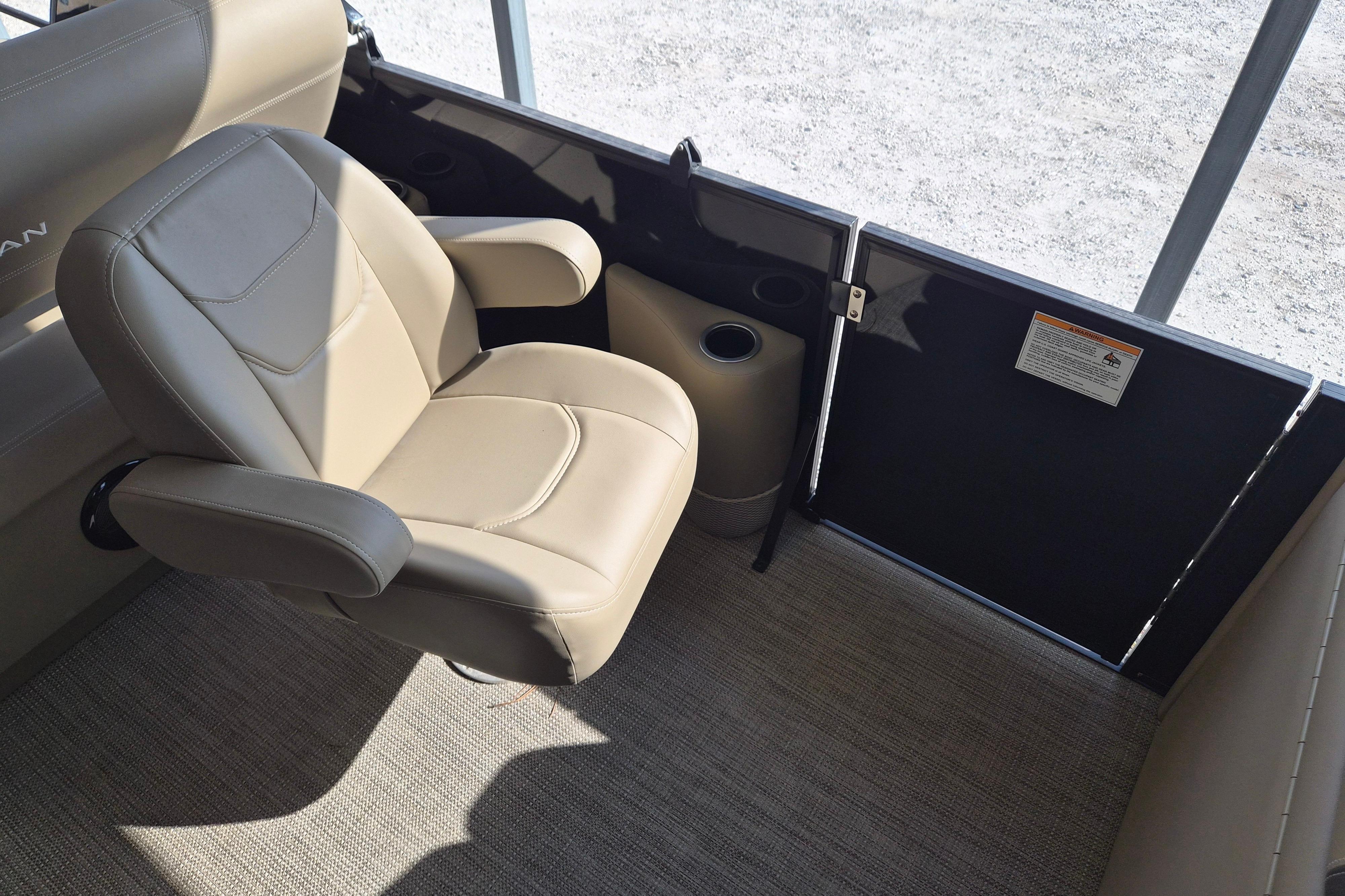 2026 Sylvan Mirage 820 CLZ DH interior with beige seating and cup holder.