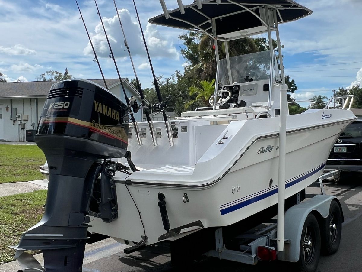 A 1994 Sea Ray Laguna boat on a trailer with a Yamaha outboard motor.