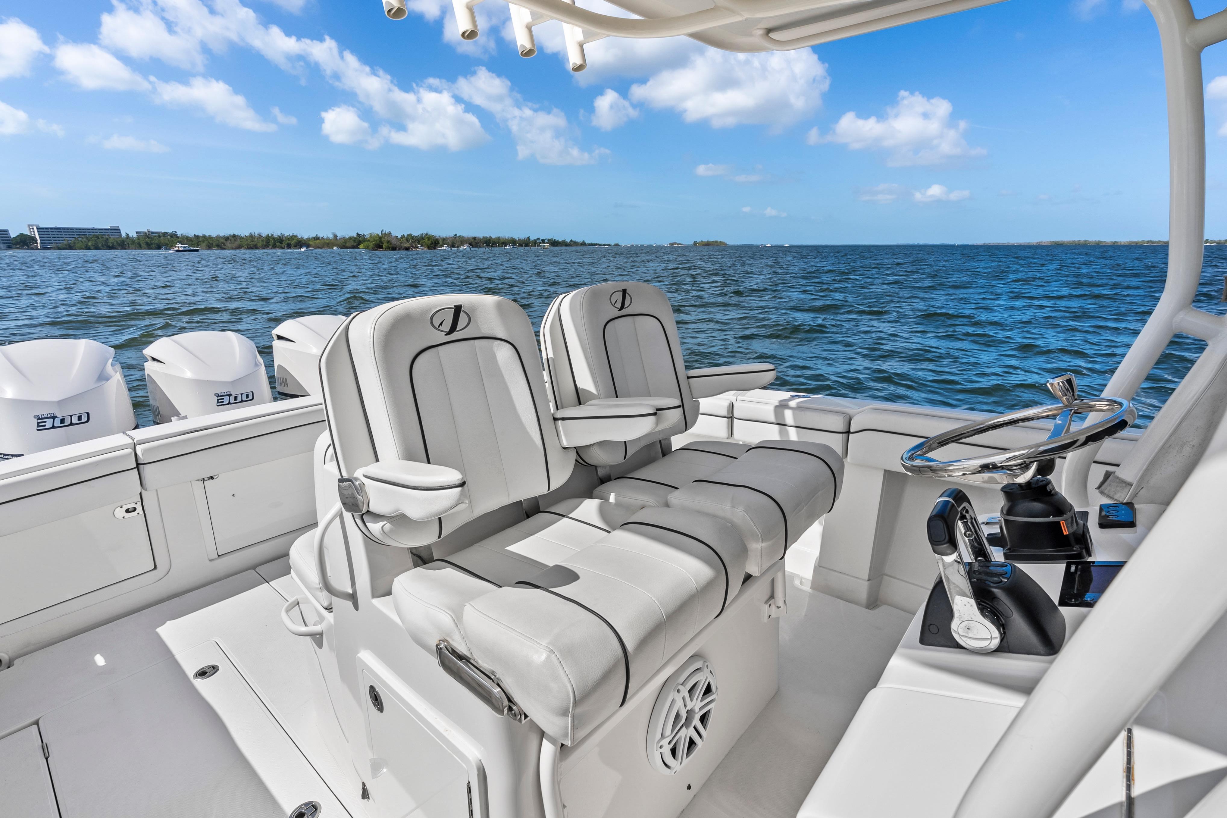 2015 Jupiter 34 HFS boat interior with helm, seating, and ocean view.