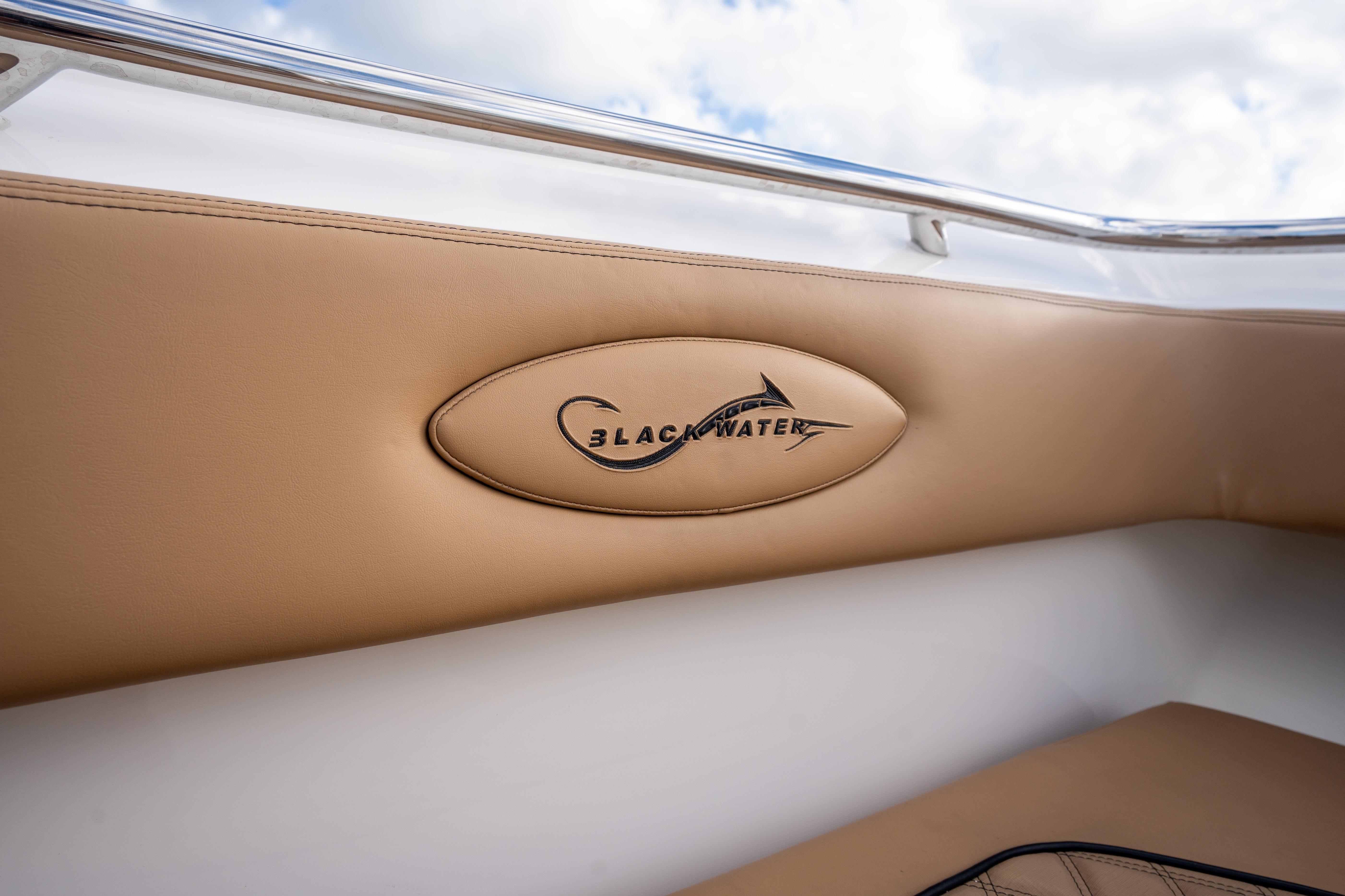 2026 Blackwater 41 Performance Fish boat interior with logo on tan upholstery.