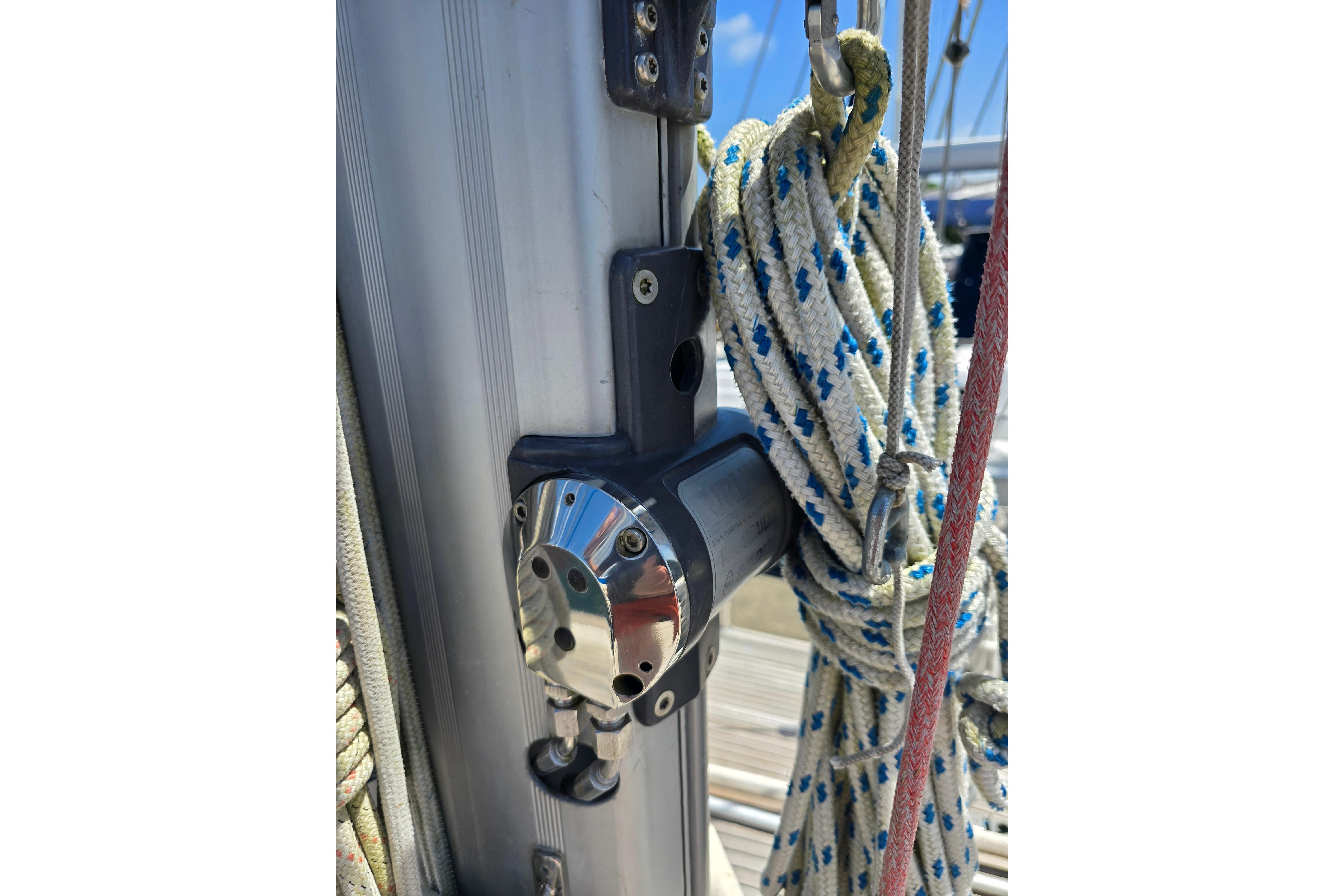 Close-up of Hallberg-Rassy 42F Mk II sailboat rigging, featuring ropes and metal fittings.