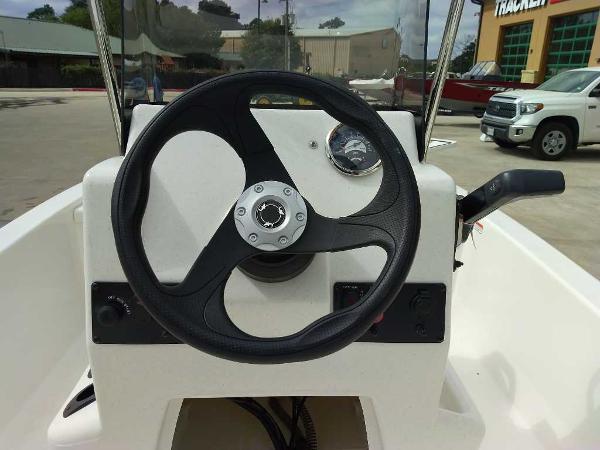 2025 Mako Pro Skiff 13 CC steering console with black wheel and gauge.