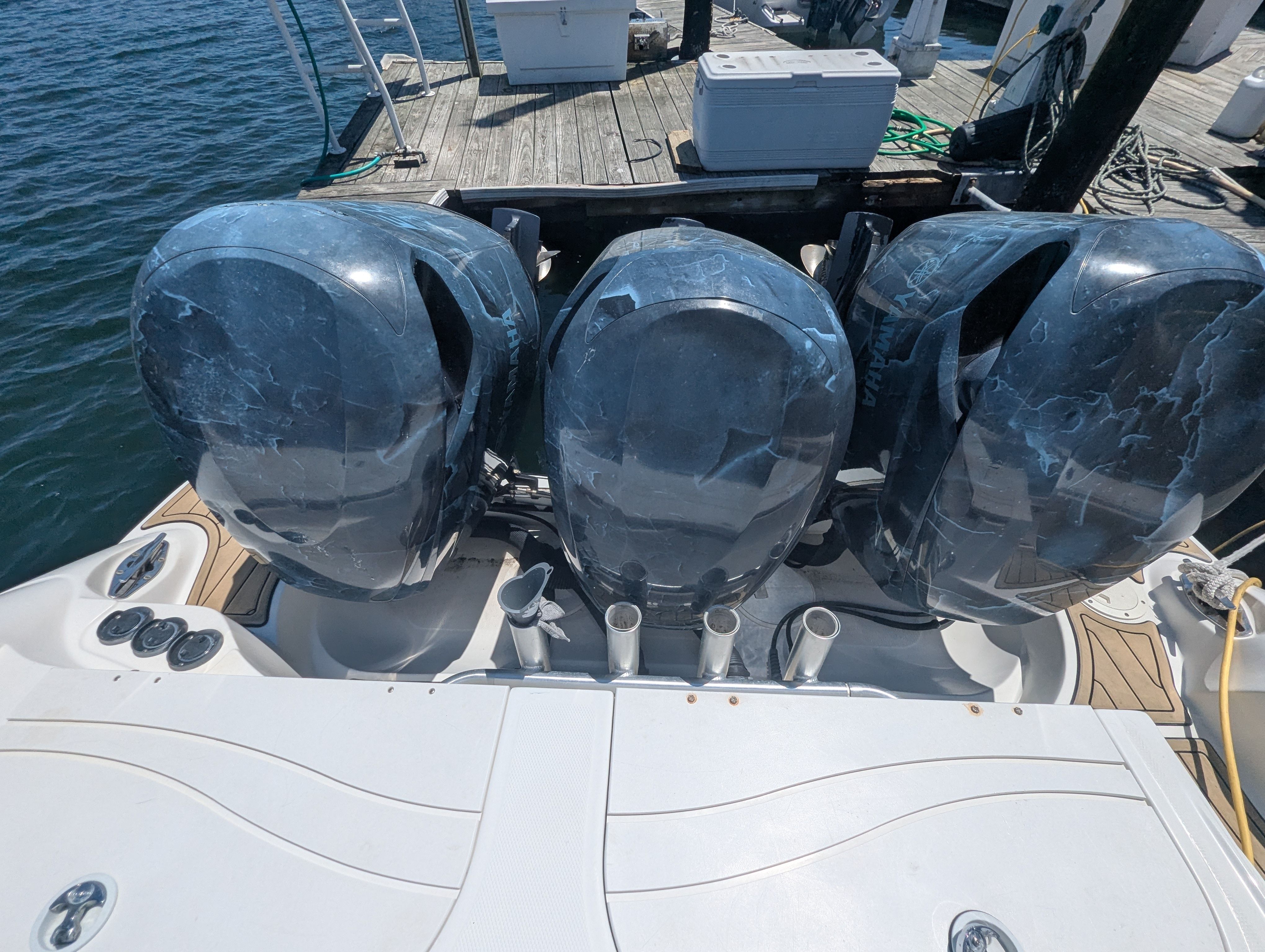 Three outboard engines on a 2005 Wellcraft 35 CCF boat.